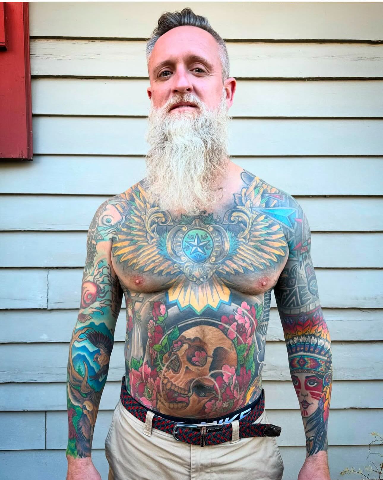 Bearded man with chest tattoo American traditional tattoo on the chest by Jeremy Justice, New Orleans, Louisiana