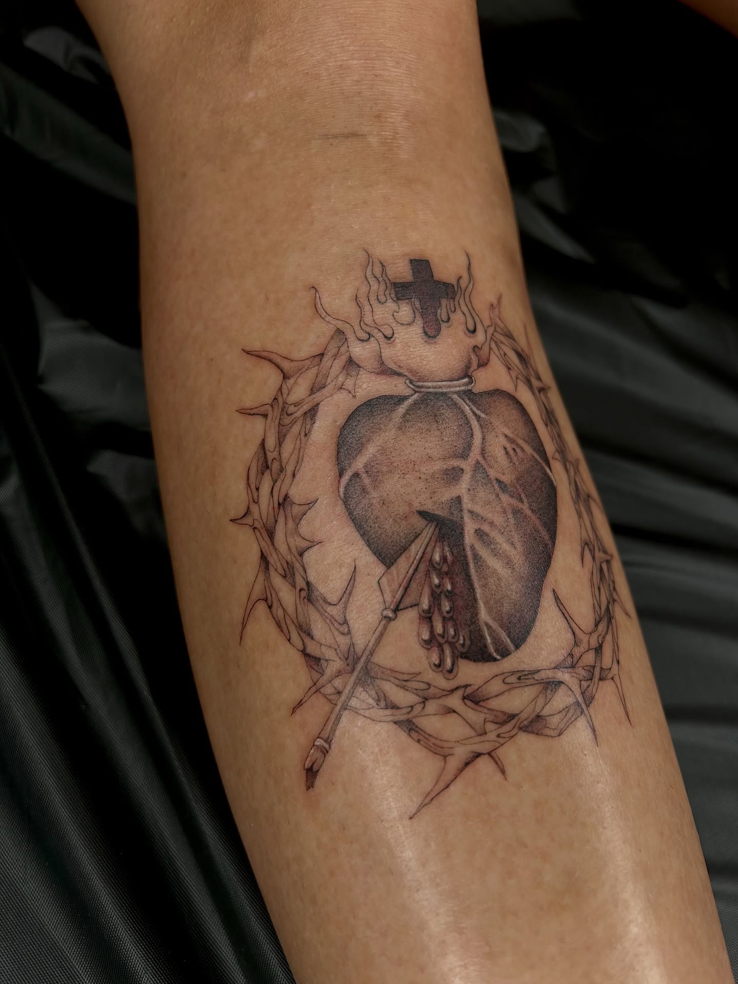 Heart with crown of thorns realism tattoo on the forearm by ✭ Elisa ✭