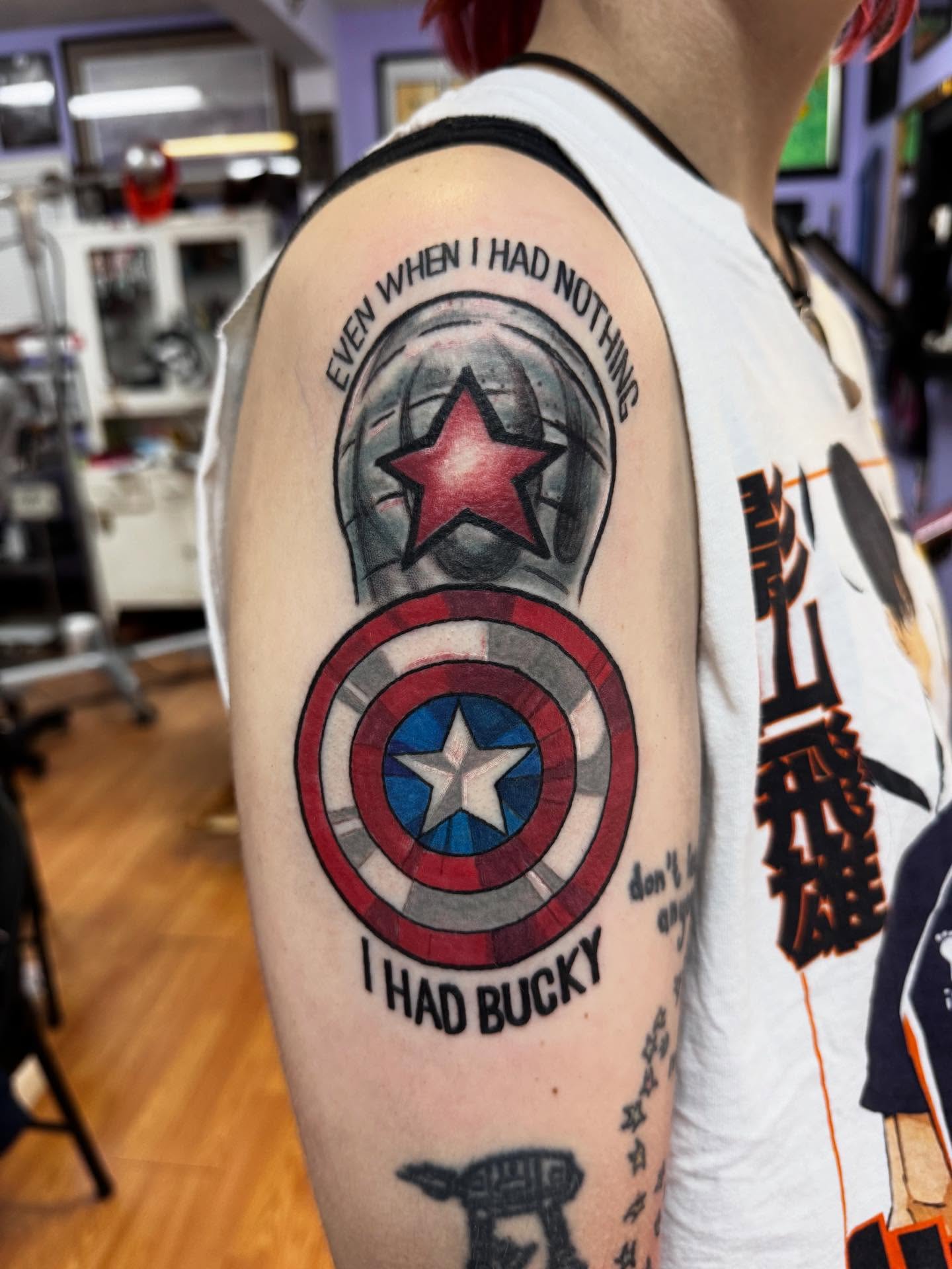 Captain america shield realism tattoo on the forearm by Justin Fiveson