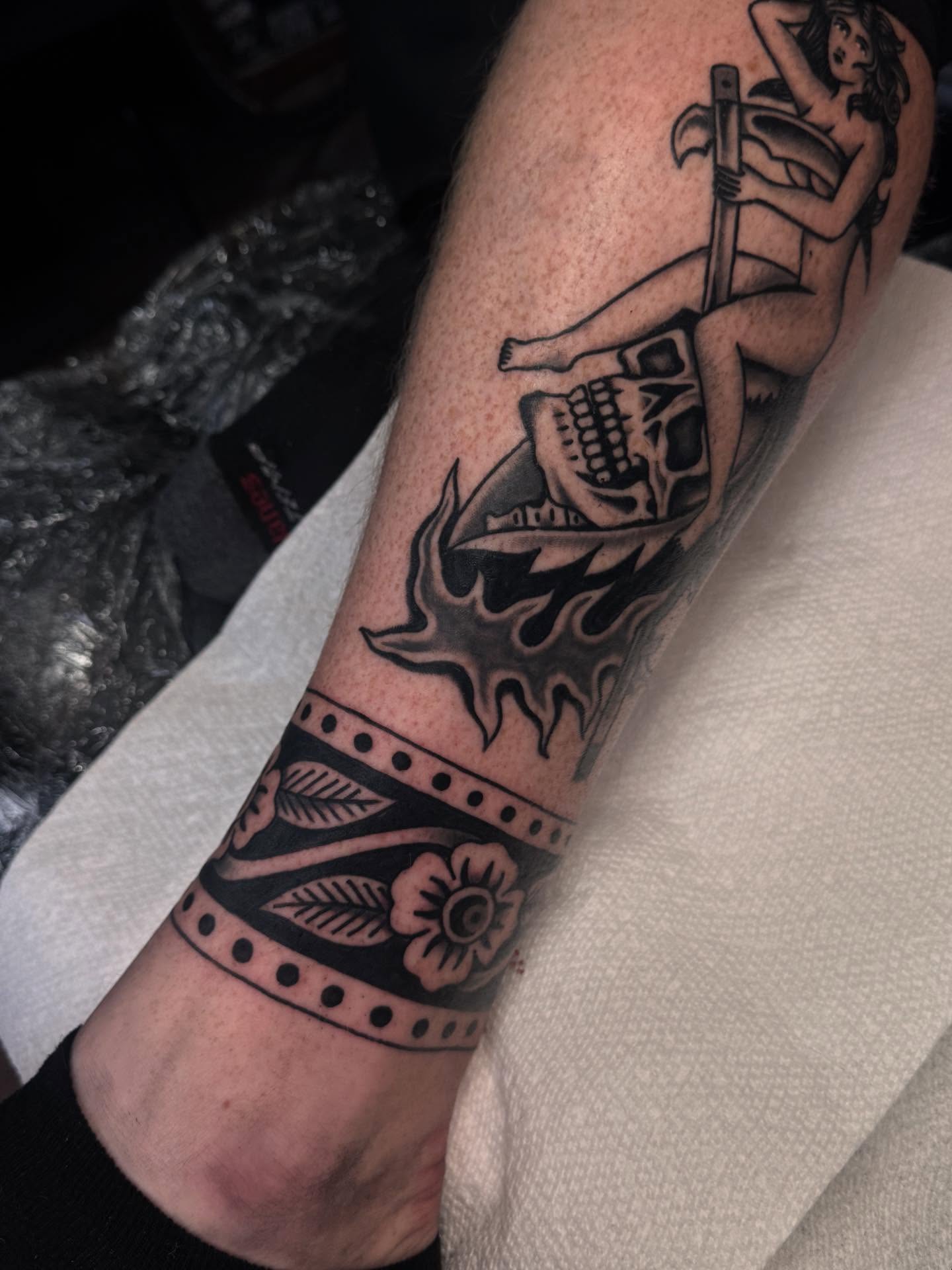 Woman with hammer American traditional tattoo on the forearm by Ryan Engels
