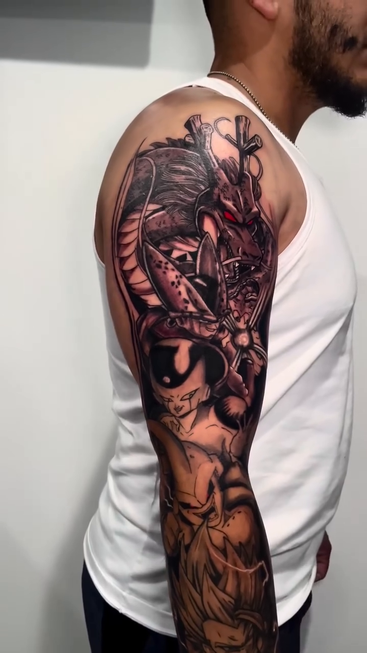 Dragon Ball Z characters and dragon realism tattoo by Miguel Garcia