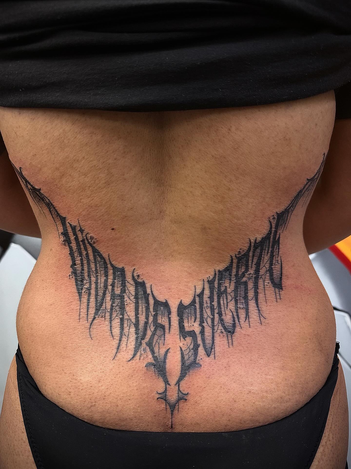Script lettering lettering script tattoo on the torso by Manny