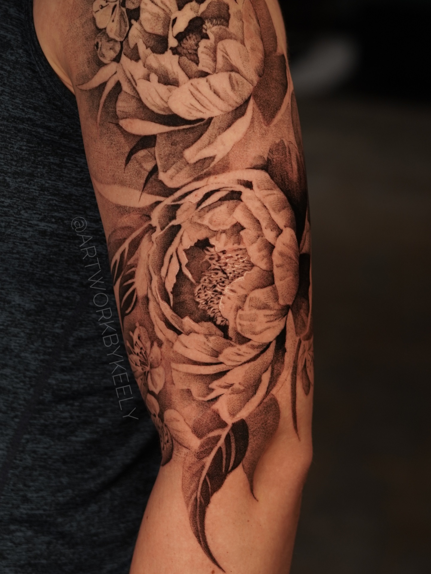 Peony black and grey tattoo on the forearm by Keely Thompson