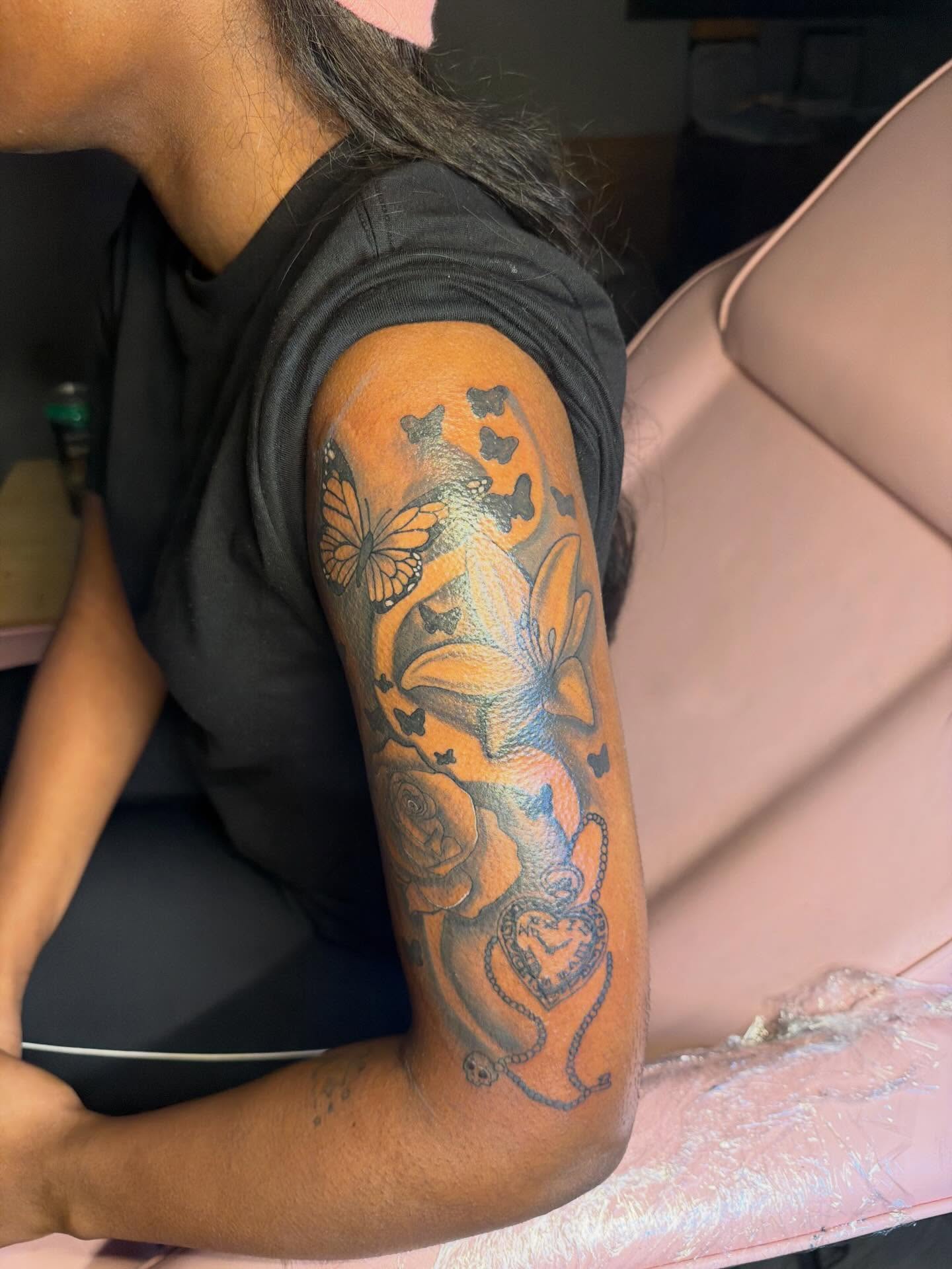 Butterflies and roses new school tattoo on the forearm by Tatted By Layy