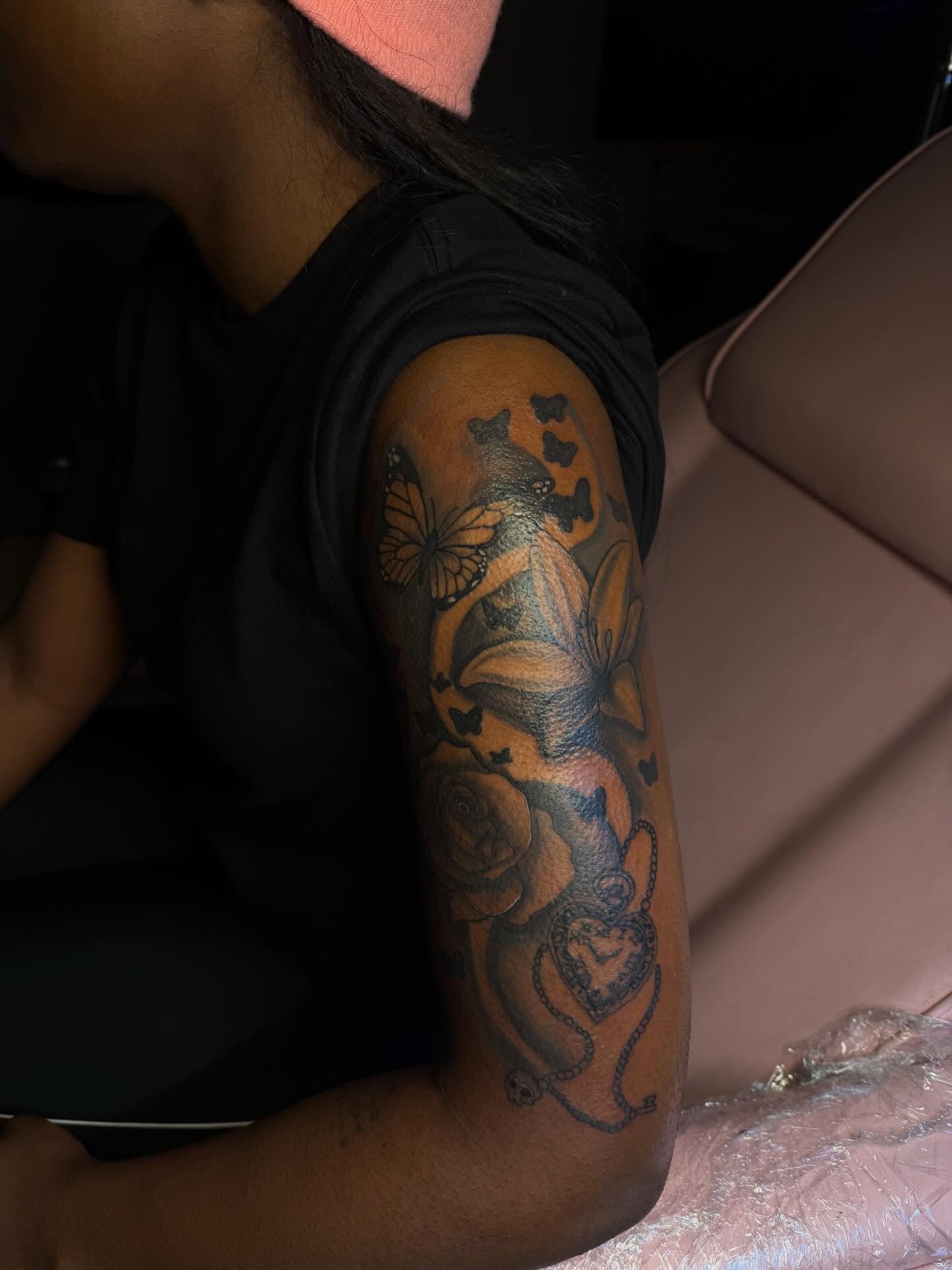 Butterflies and roses realism tattoo on the forearm by Tatted By Layy