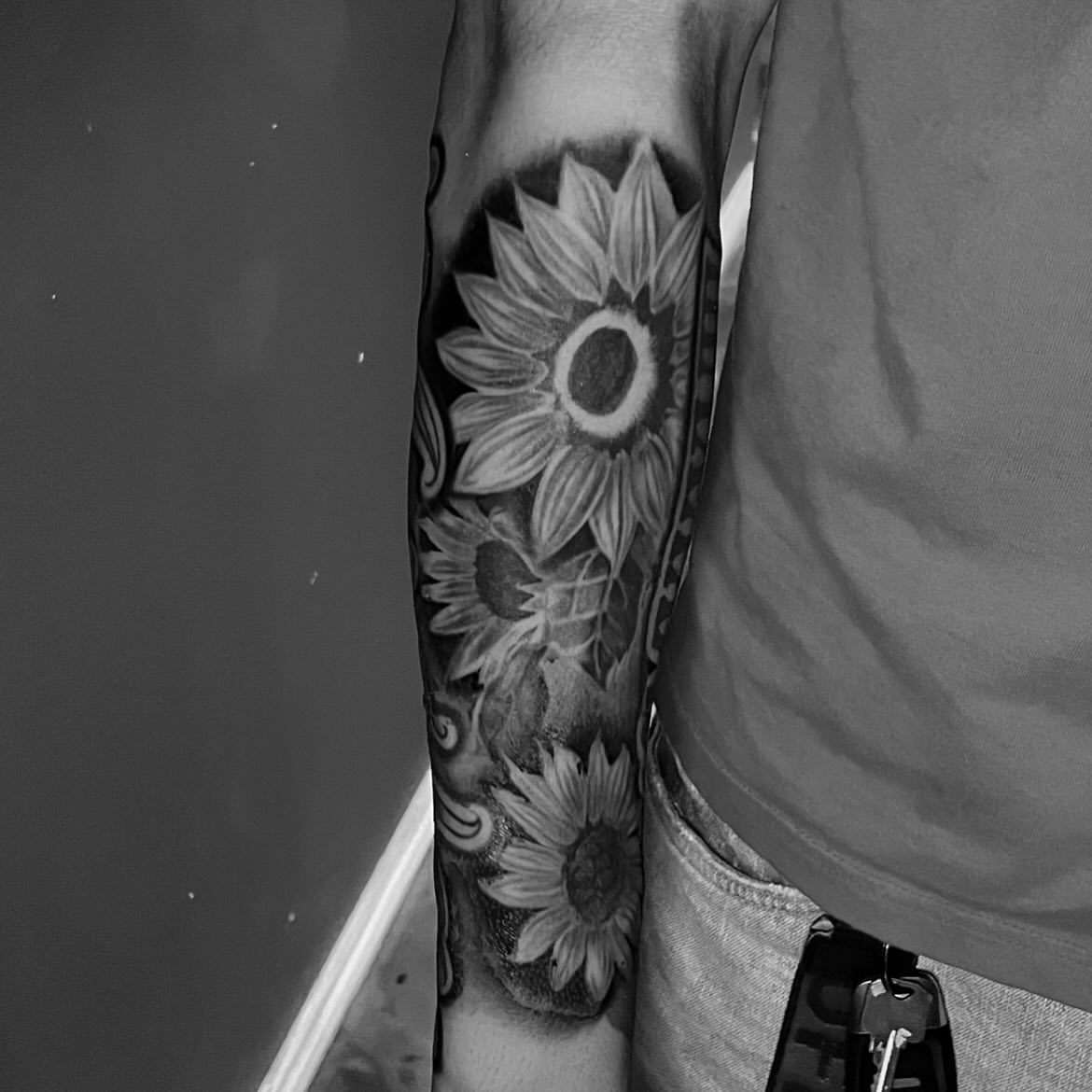 Sunflower black and grey tattoo on the forearm by Chubbs