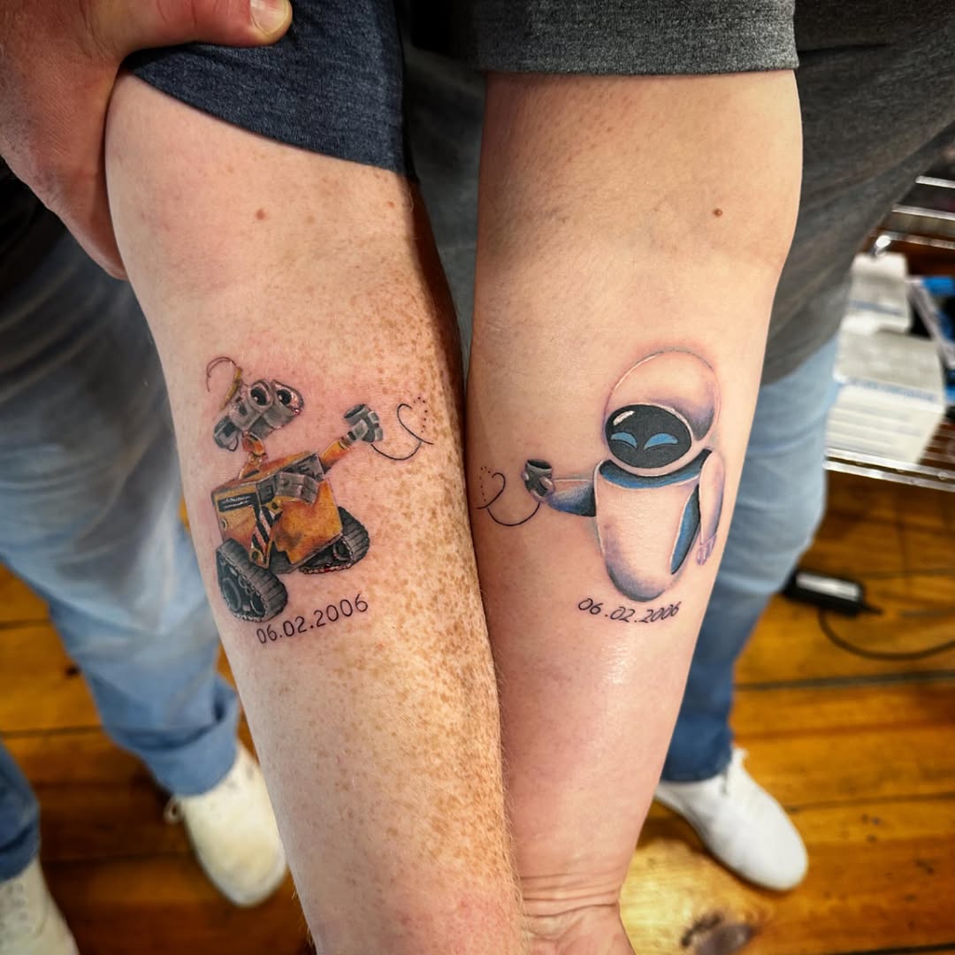 Wall-E and EVE robots minimalist tattoo on the forearm by manda, Lebanon, Ohio