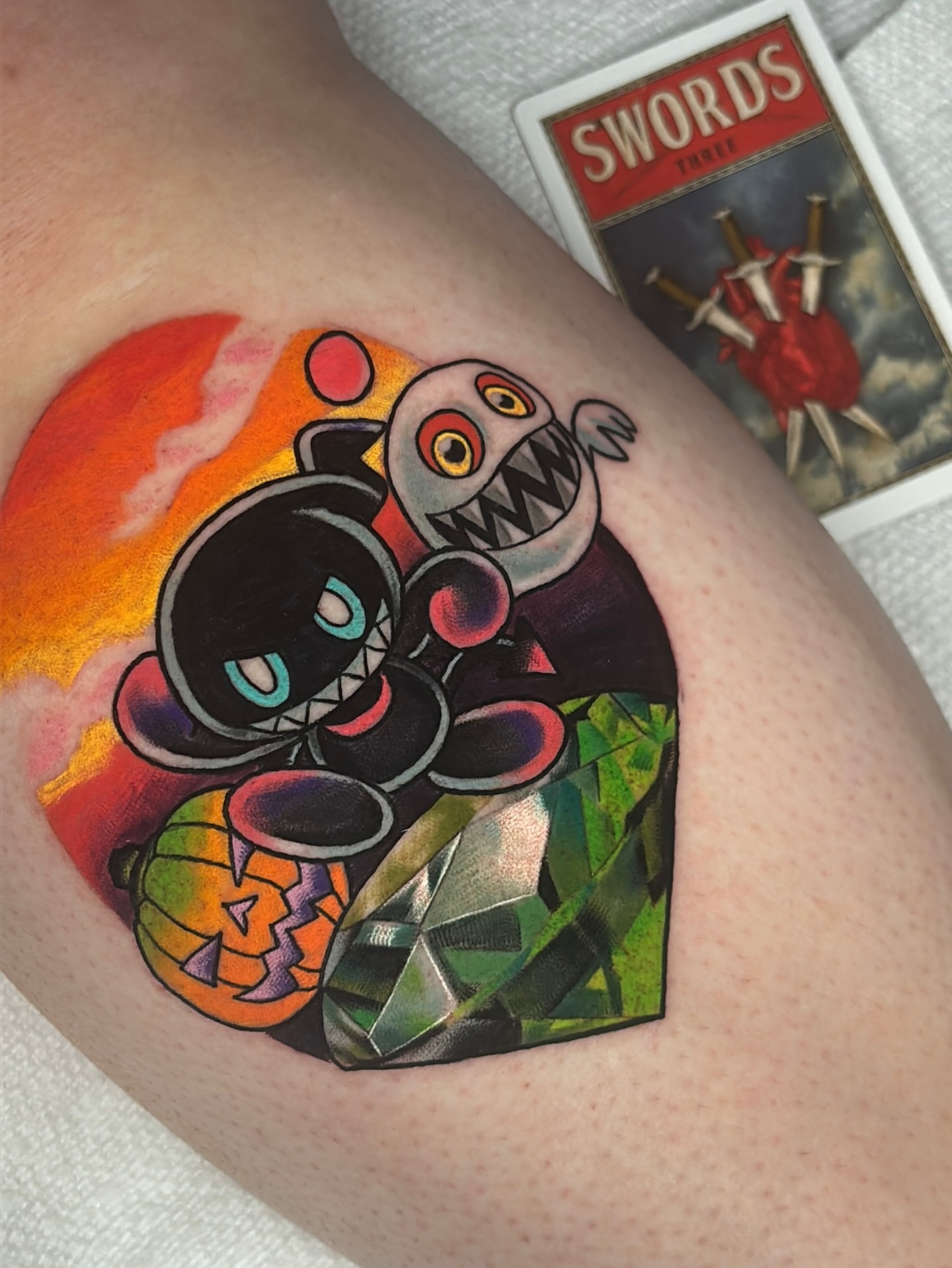 Monster with pumpkin geometric tattoo on the thigh by Latesha Burnley
