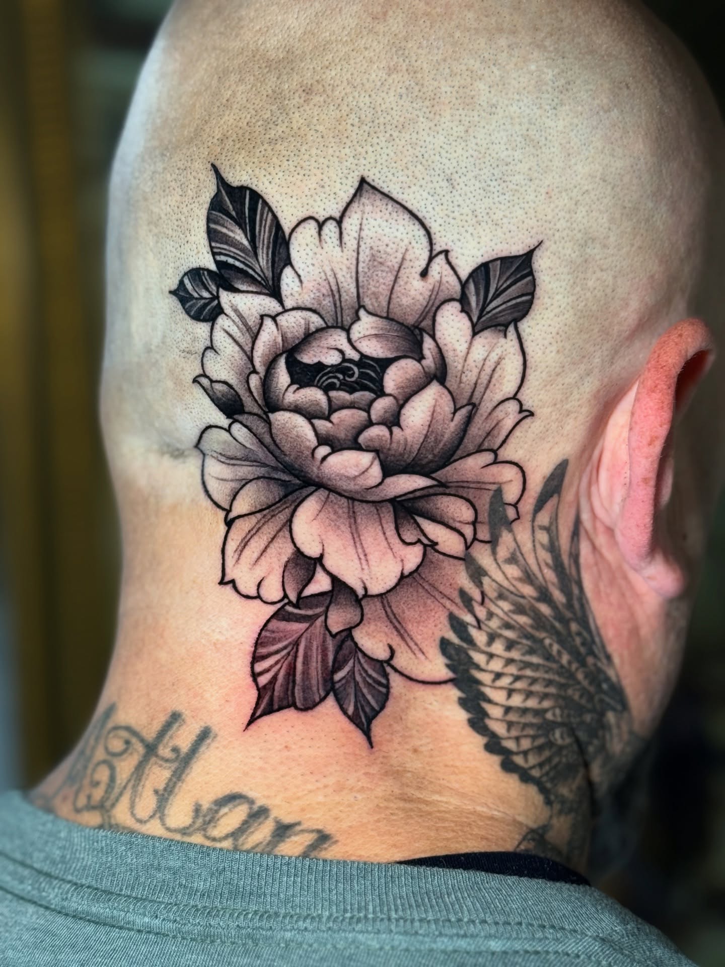 Peony black and grey tattoo on the neck by Sergio Mendez
