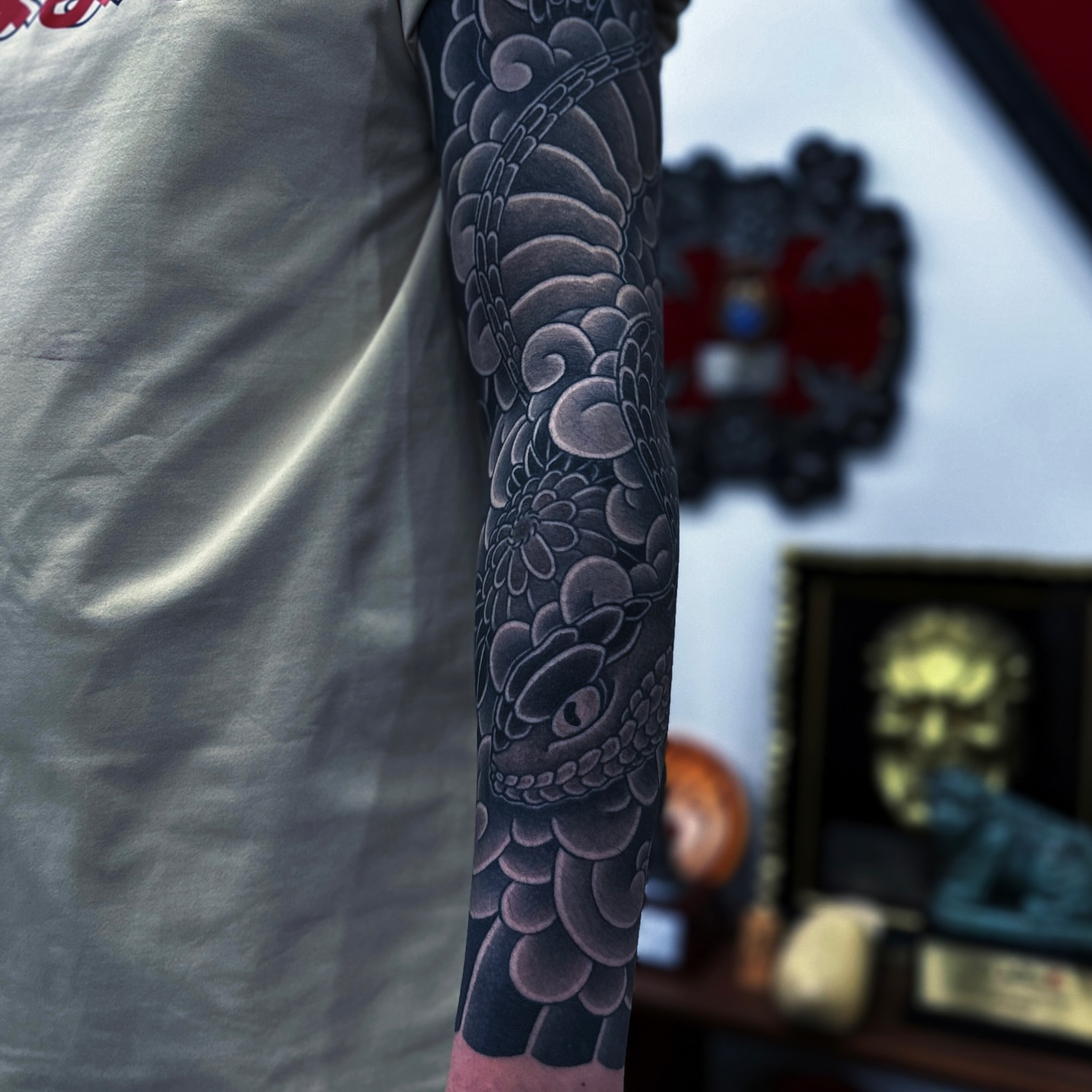 Serpent black and grey tattoo on the forearm by JM kim, Melbourne, Victoria