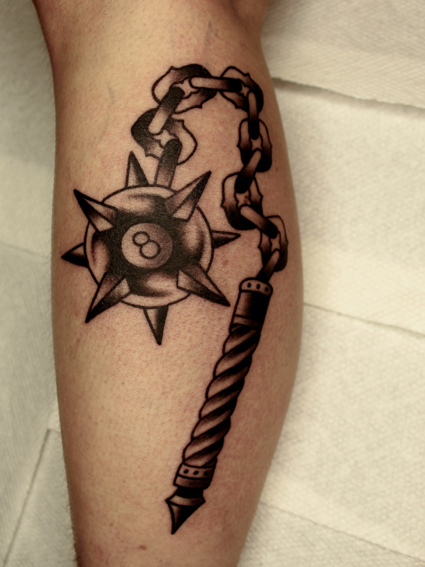 Billiard ball and anchor black and grey tattoo on the forearm by Kehrmie Tattoos, Berkeley, California