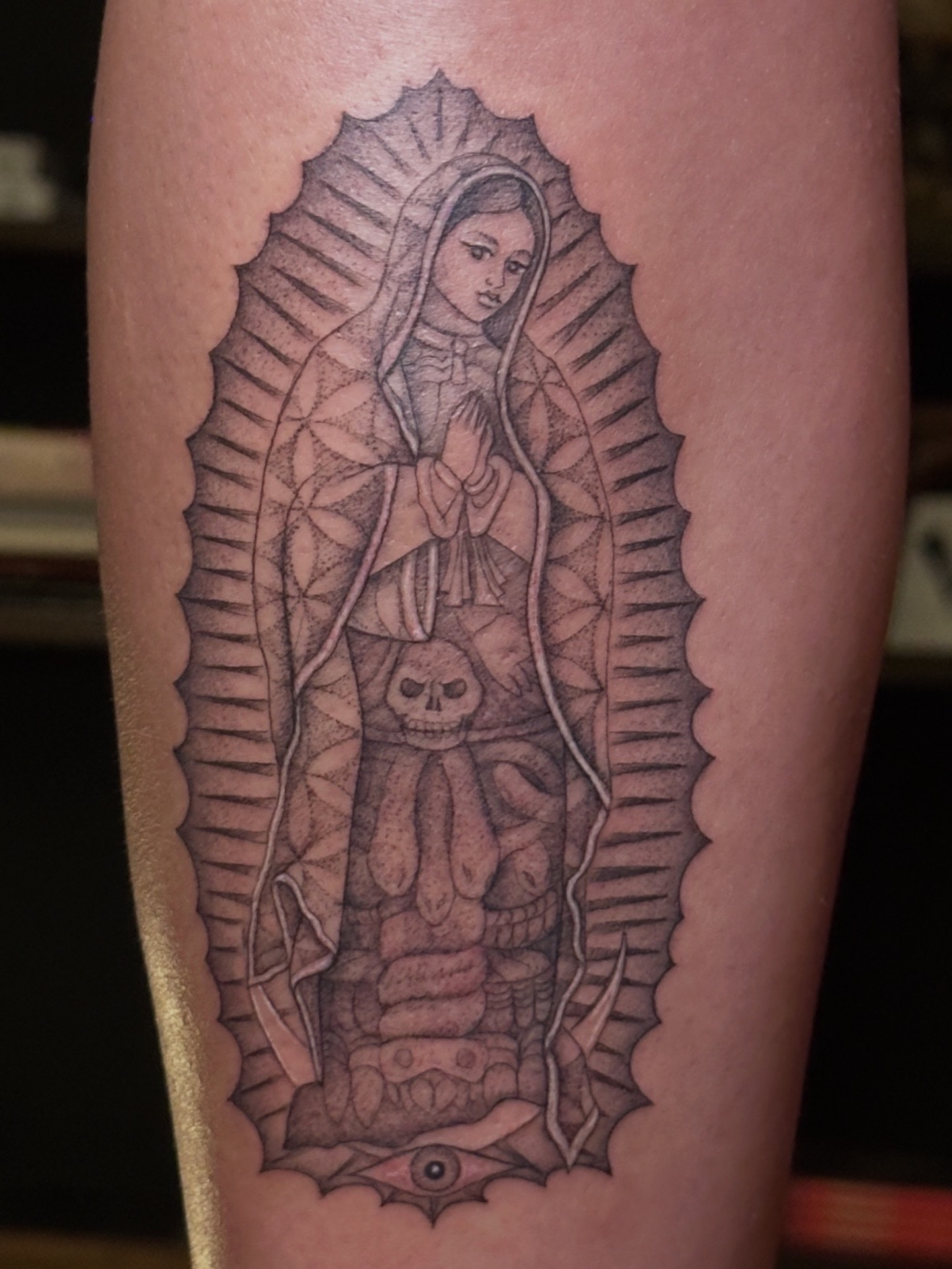 Our Lady of Guadalupe geometric tattoo on the forearm by Carmen Figueroa, New York, New York