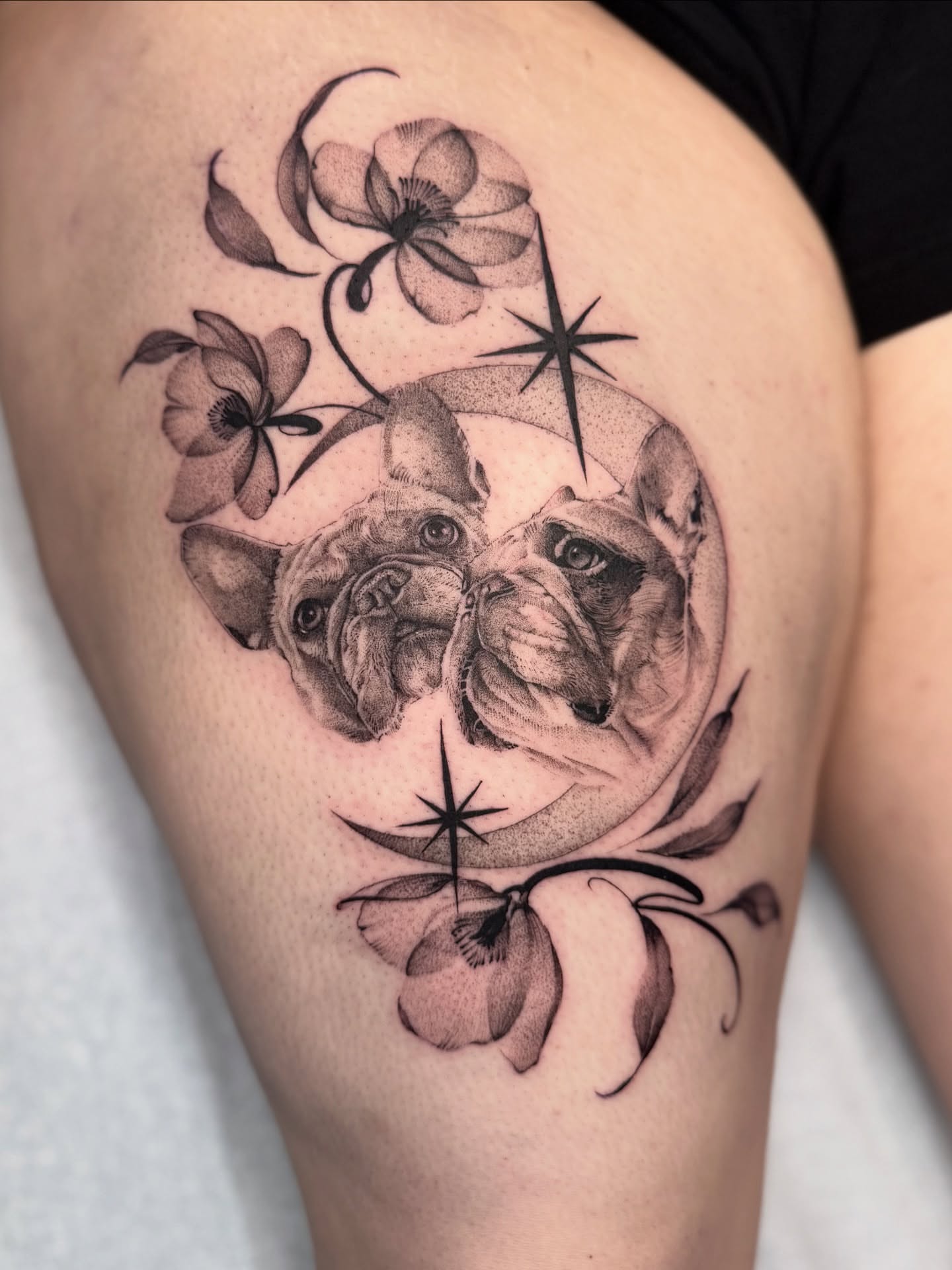 Bulldogs and flowers realism tattoo on the thigh by Carla AKA Turnip girl
