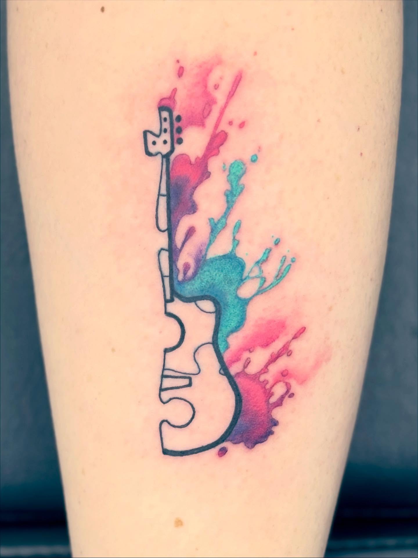 Guitar watercolor tattoo on the forearm by Aaron Hassler, Nashville, Tennessee