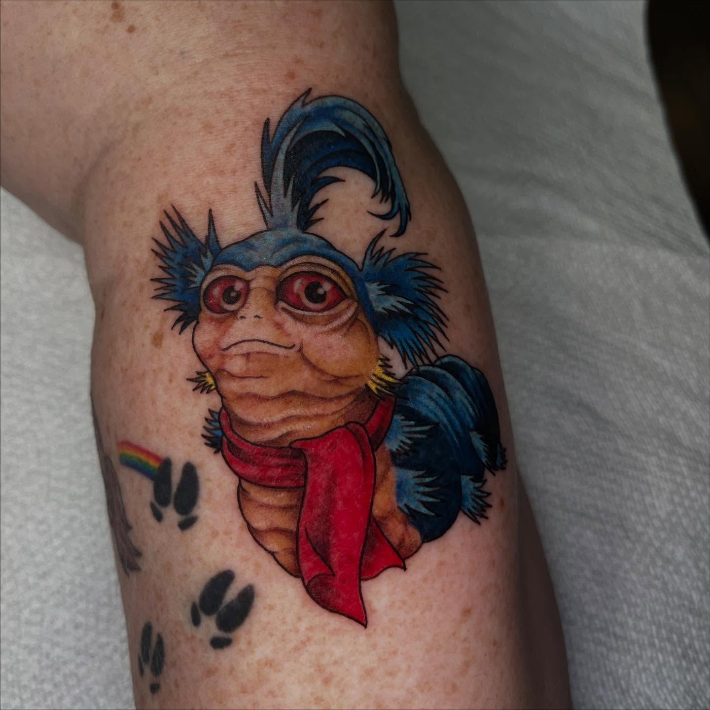 Gremlin with blue hat American traditional tattoo on the forearm by Ty’s Tattoos