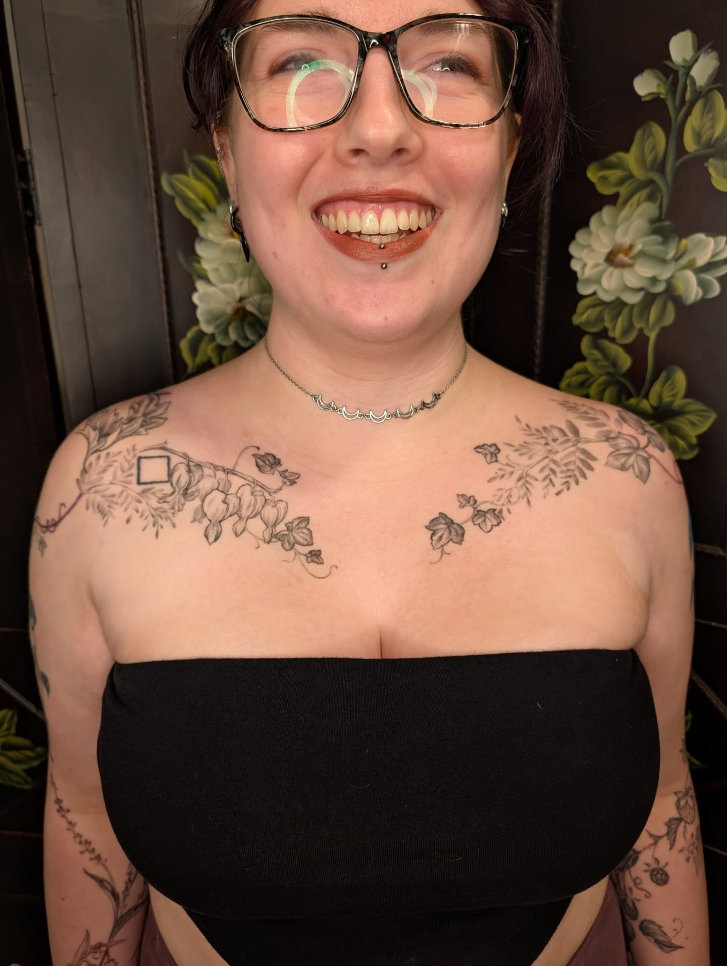 Floral vine black and grey tattoo on the chest by Jeanine, Providence, Rhode Island