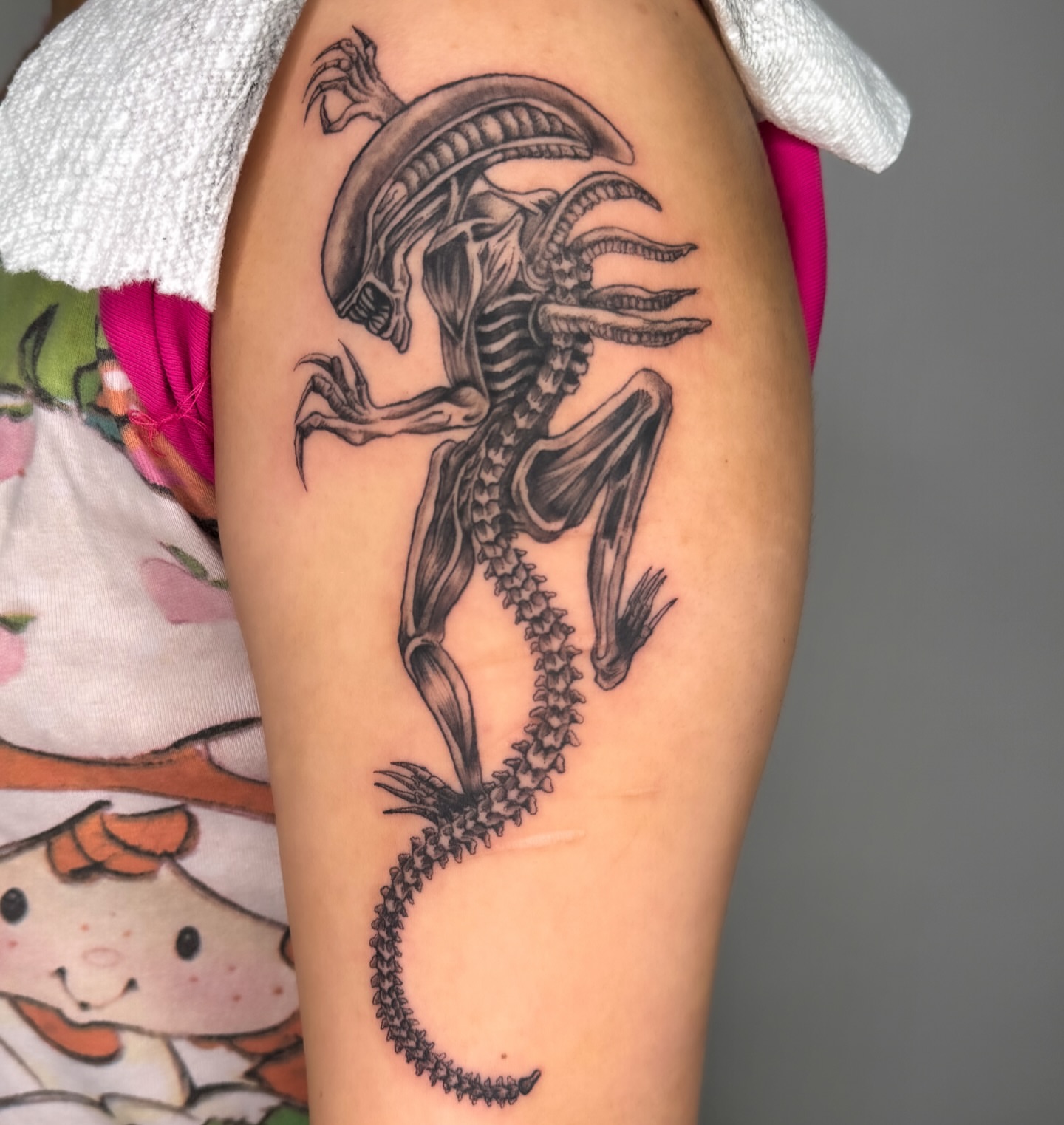 Alien creature realism tattoo on the forearm by Tiffany