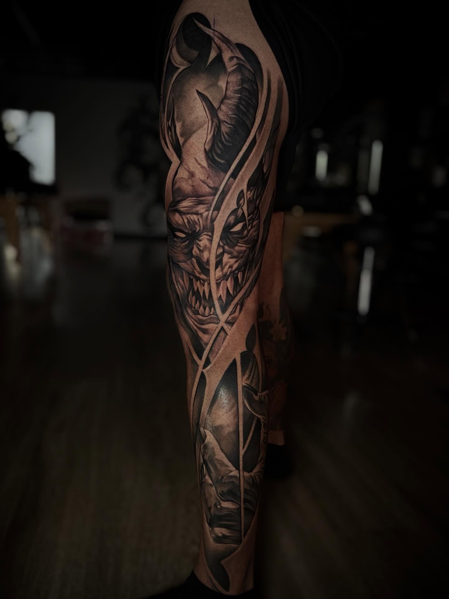 Demon face dark realism tattoo on the forearm by Bryan ๐ฅ Loggins, Baton Rouge, Louisiana