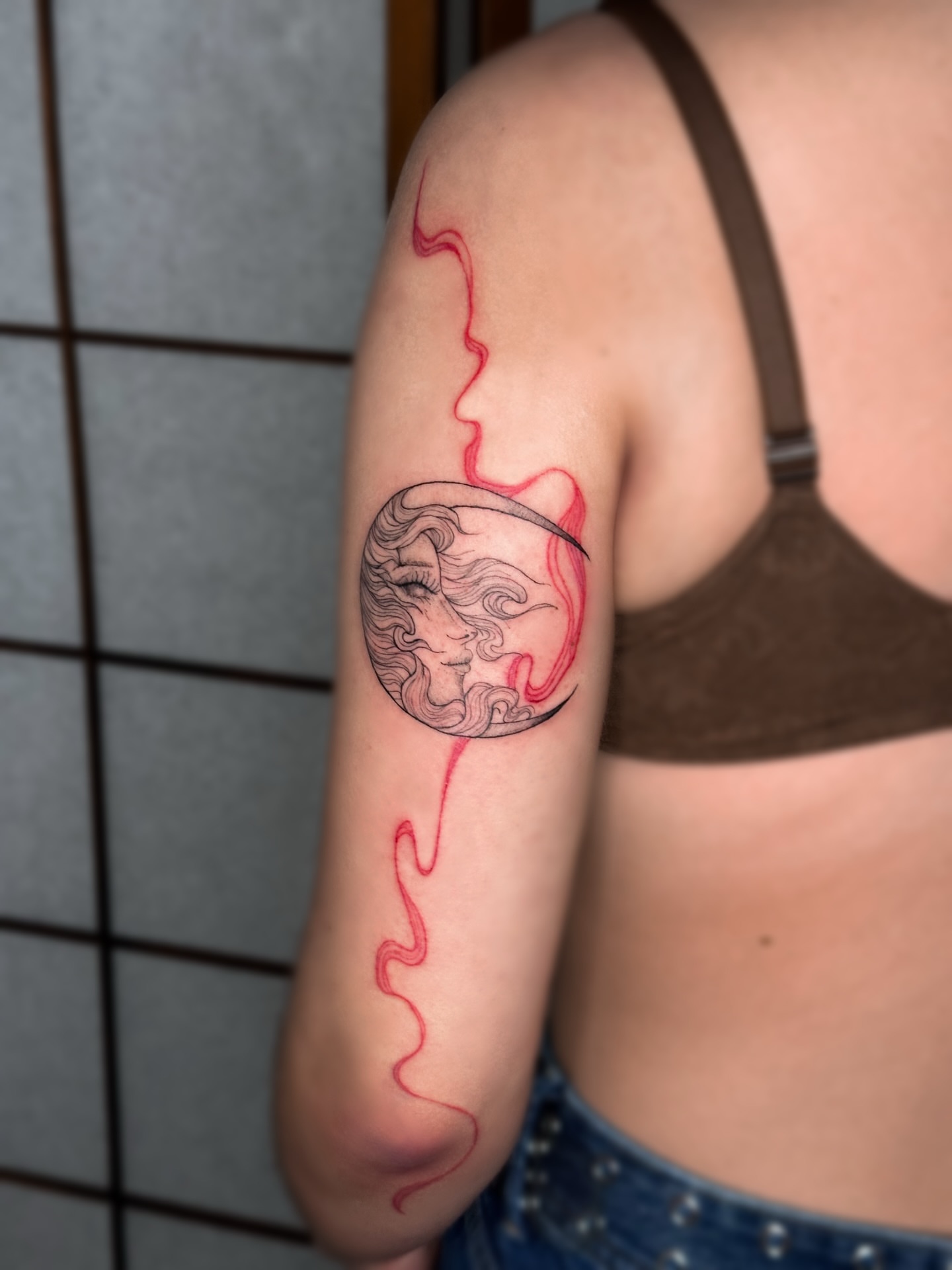 Moon with face dotwork tattoo on the forearm by Mila, Riga, Latvia
