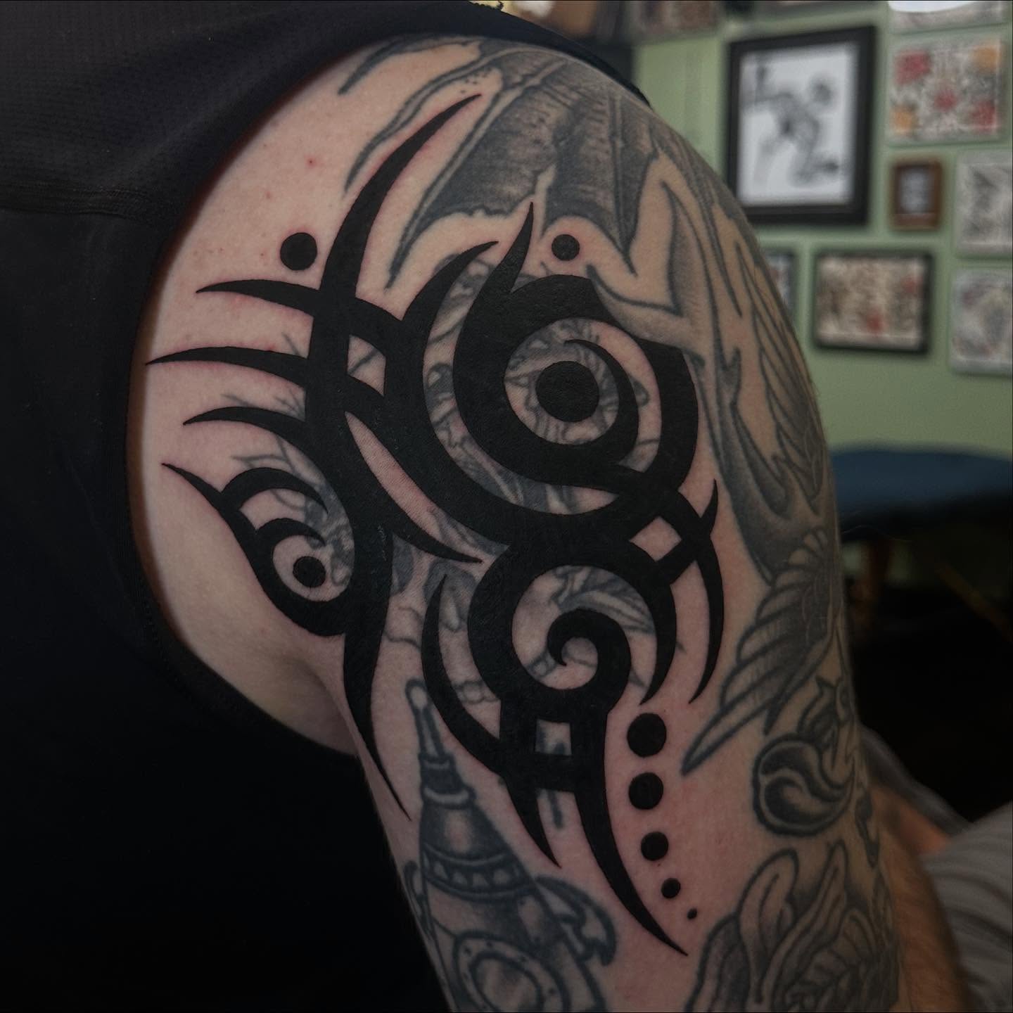 Tribal design tribal tattoo on the shoulder by Alexa Wolfkiel