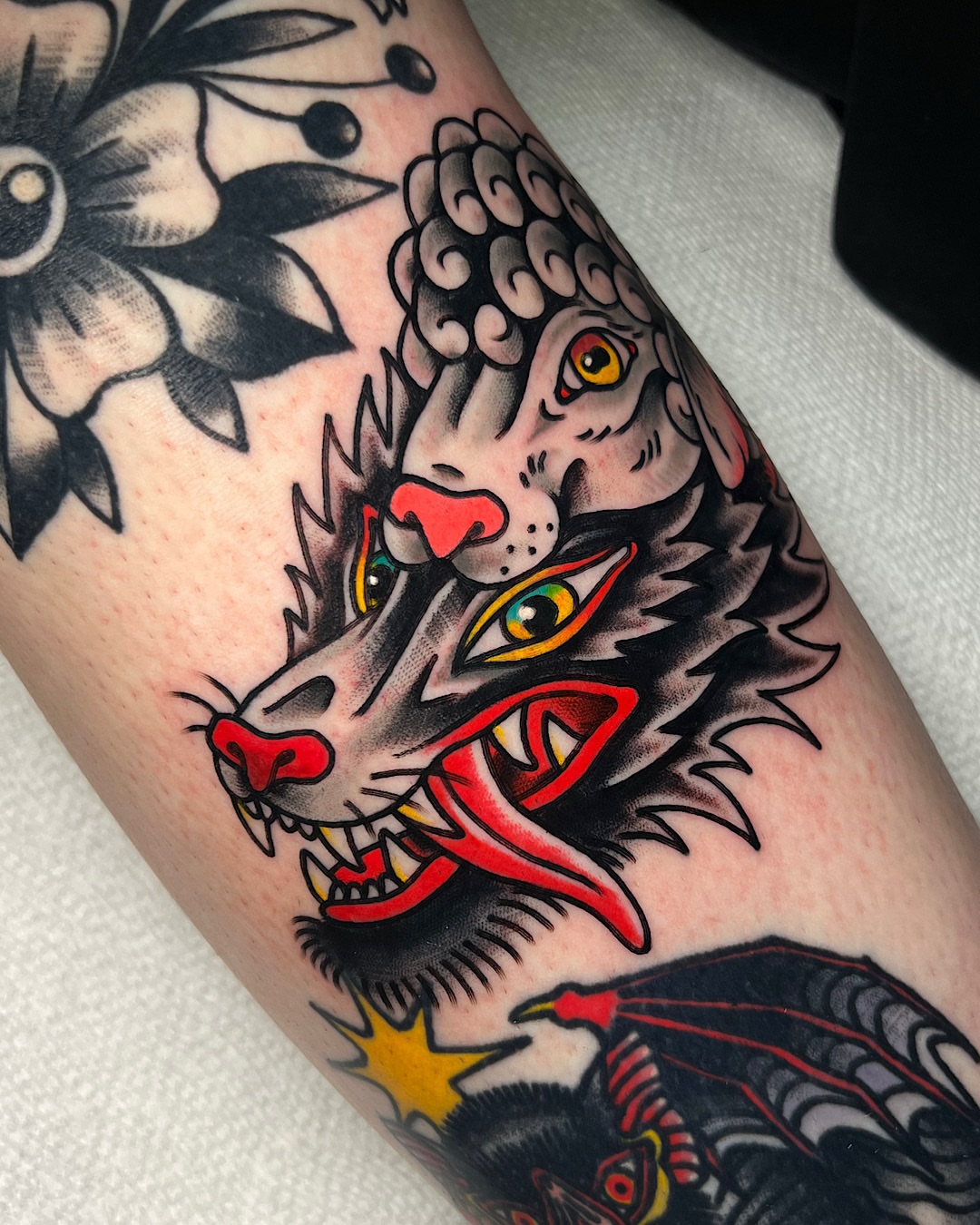 Wolf head American traditional tattoo on the forearm by @shannonkeeleyy