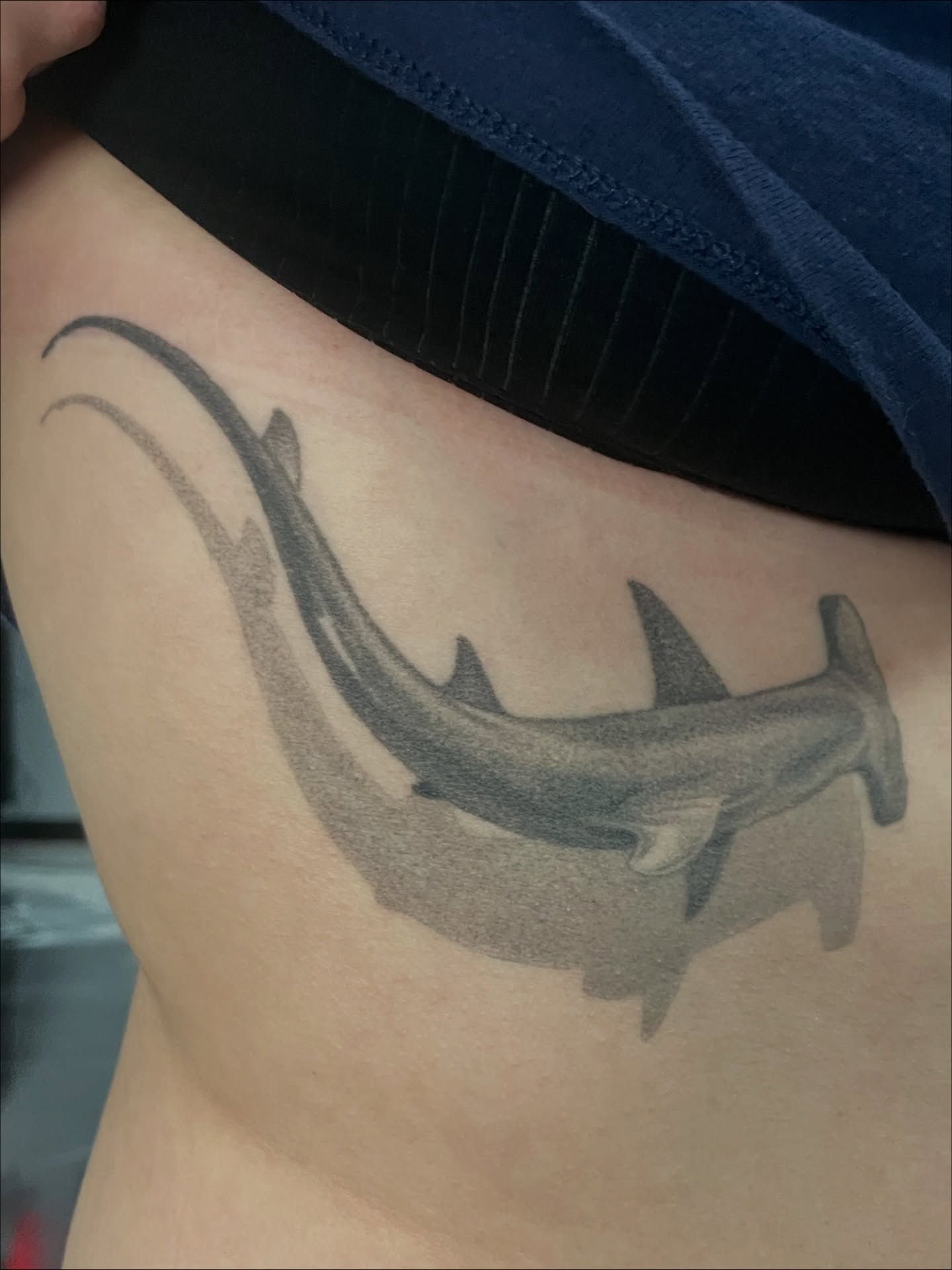 Hammerhead shark black and grey tattoo on the thigh by Candence Smith