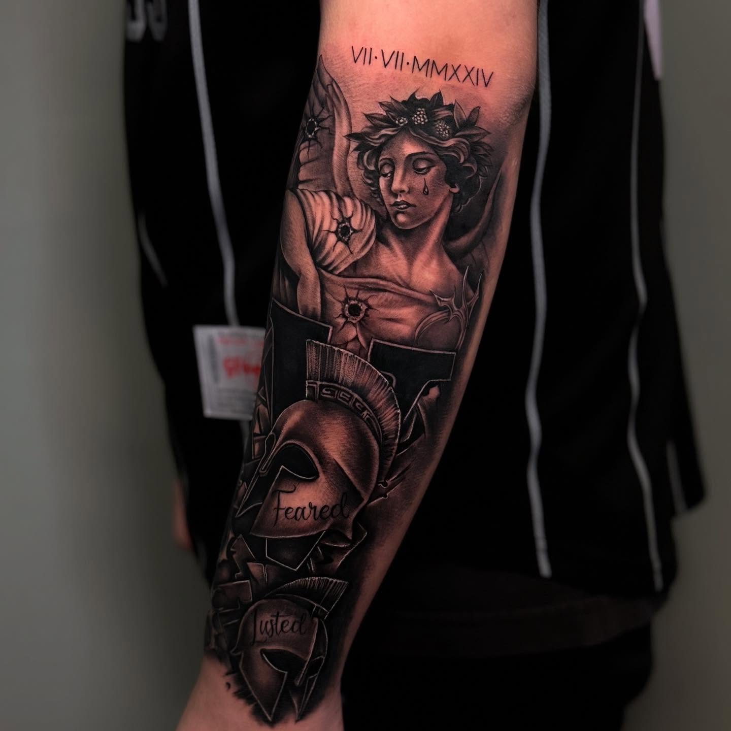 Woman with wings and helmet realism tattoo on the forearm by π·ππ