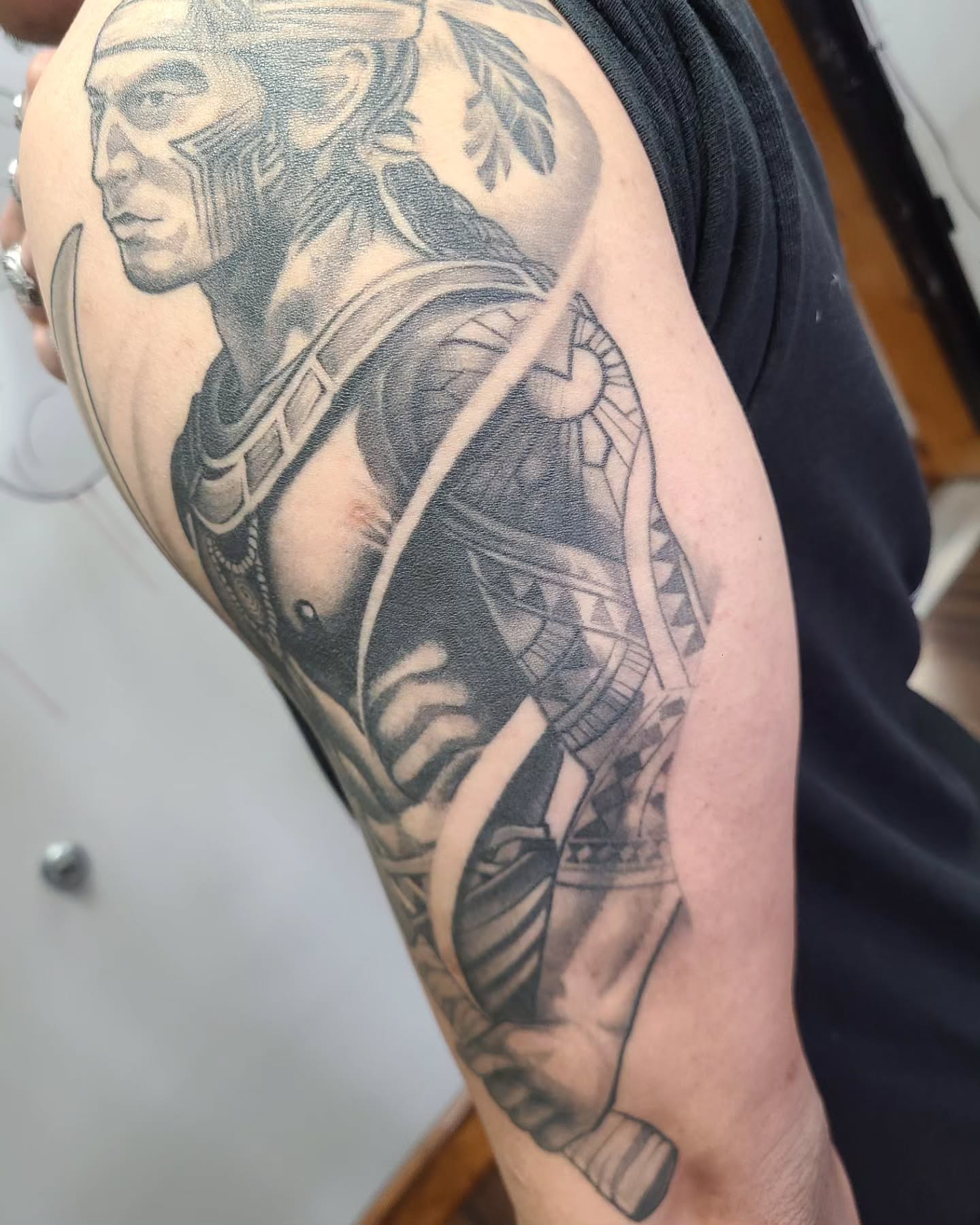 Warrior realism tattoo on the upper arm by David Vodicka