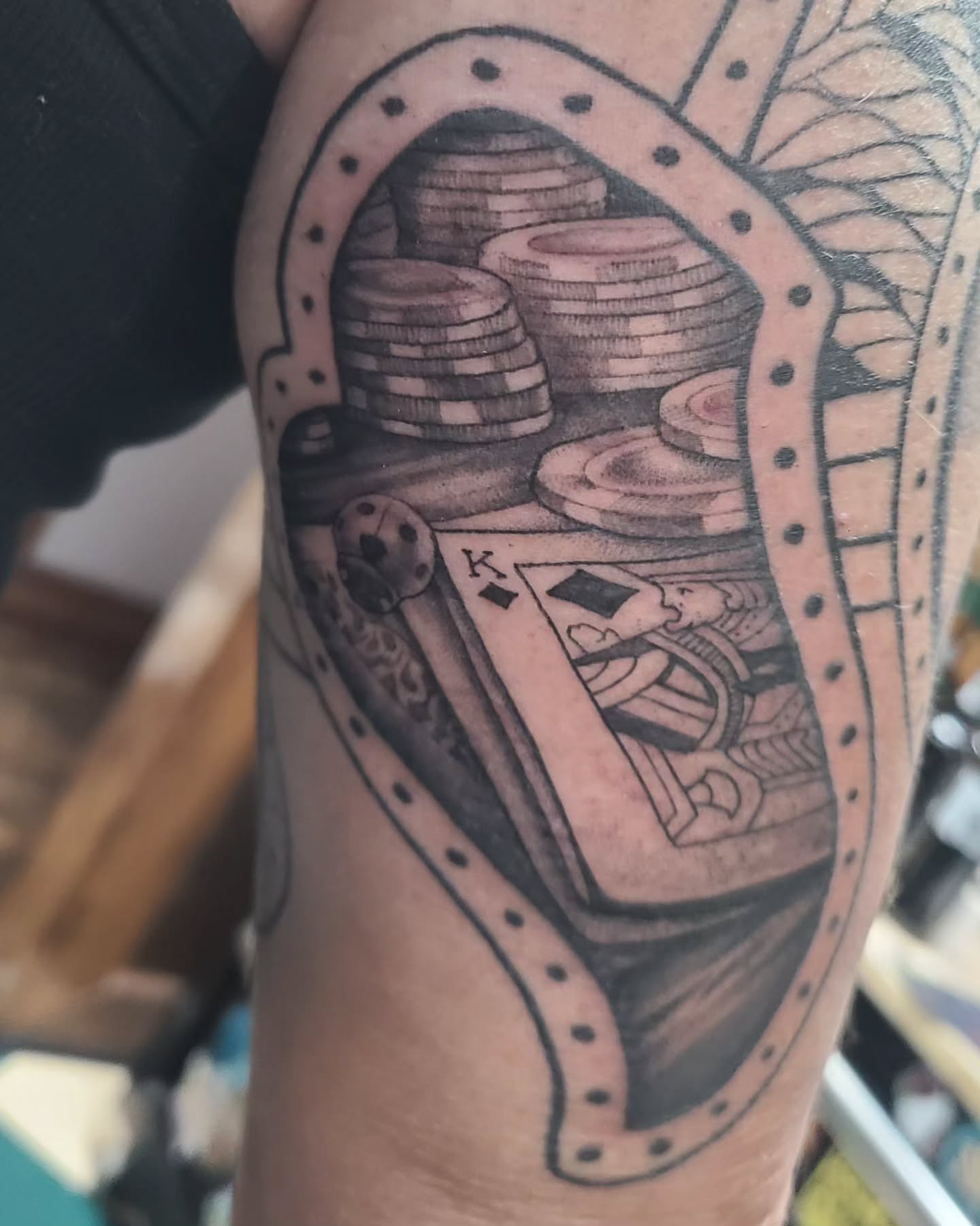 King of spades and poker chips realism tattoo on the forearm by David Vodicka