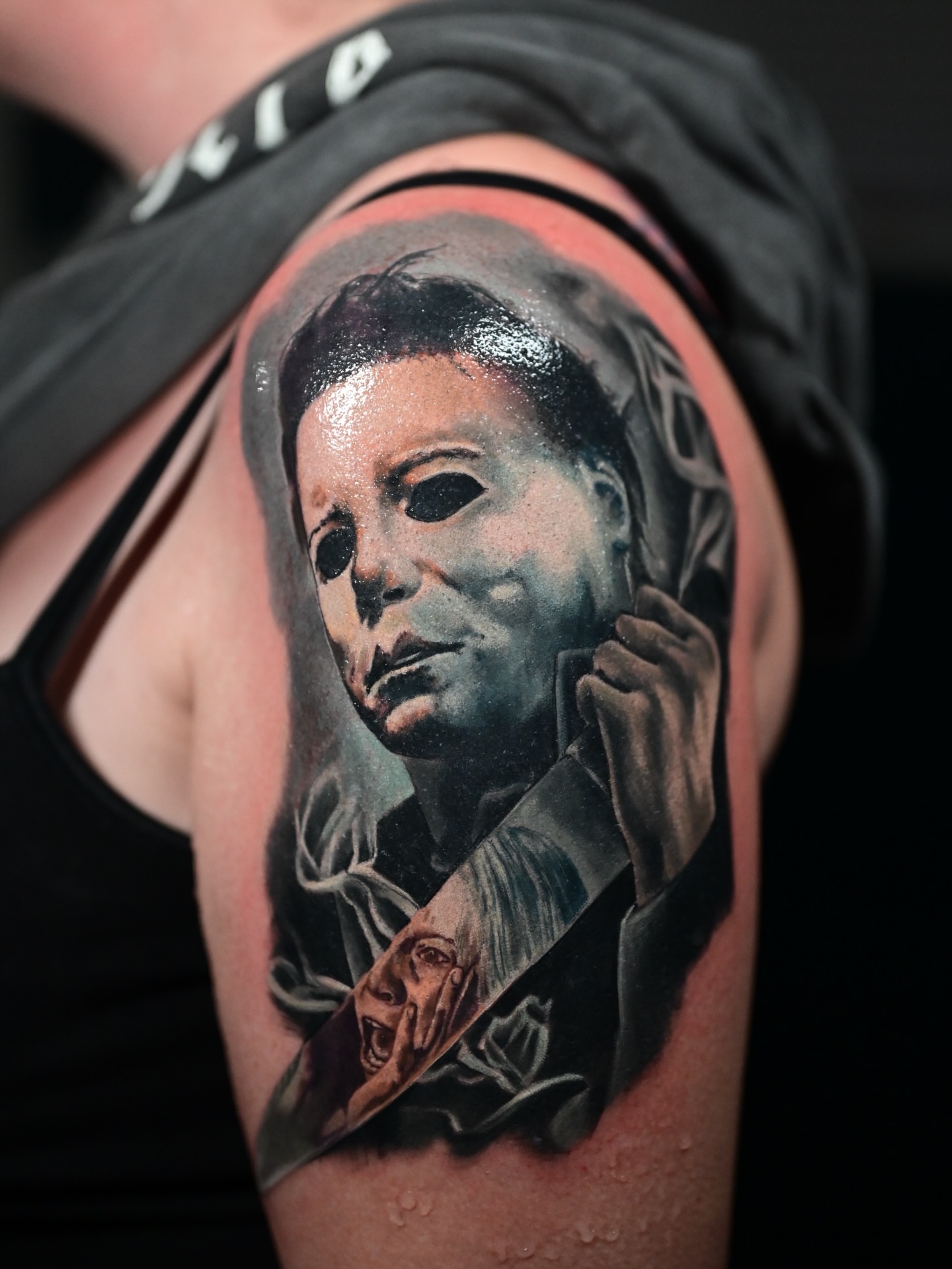Michael Myers mask realism tattoo on the shoulder by Kelsey Kemp