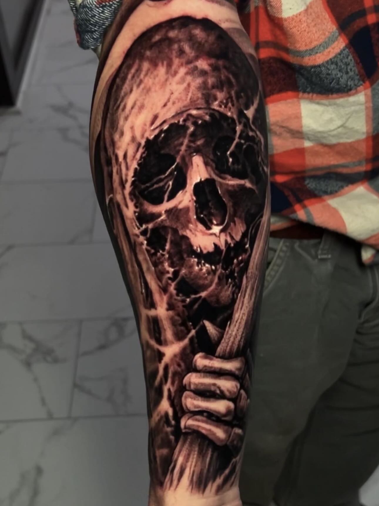Skull realism tattoo on the forearm by Danny Lepore