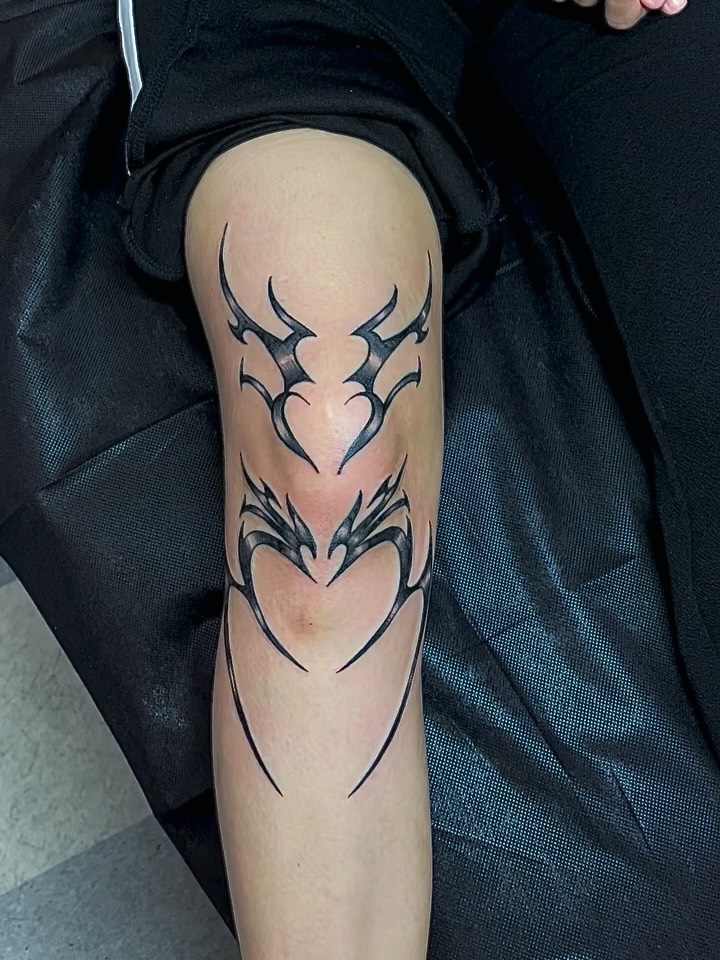 Tribal heart tribal tattoo on the thigh by Manny