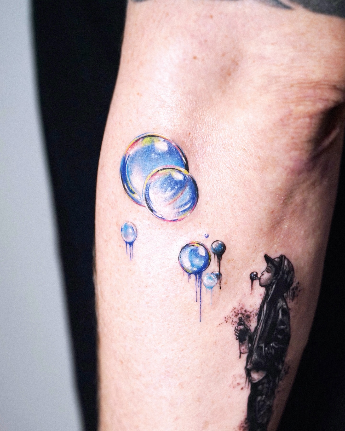 Bubble blowing realism tattoo on the forearm by Yeye