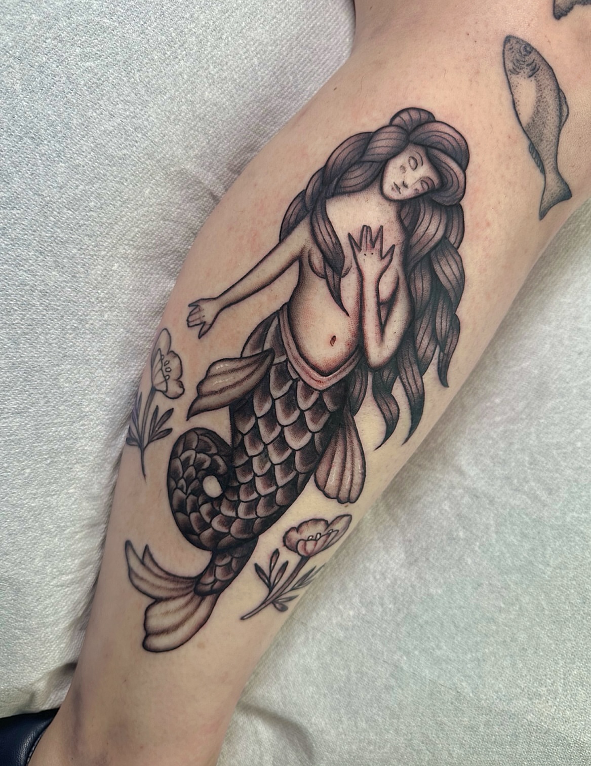 Mermaid realism tattoo on the forearm by Lawrence Edwards