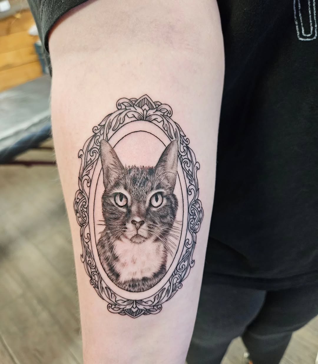 Tattoo by @nikkischertattoos — realism, black_and_grey
