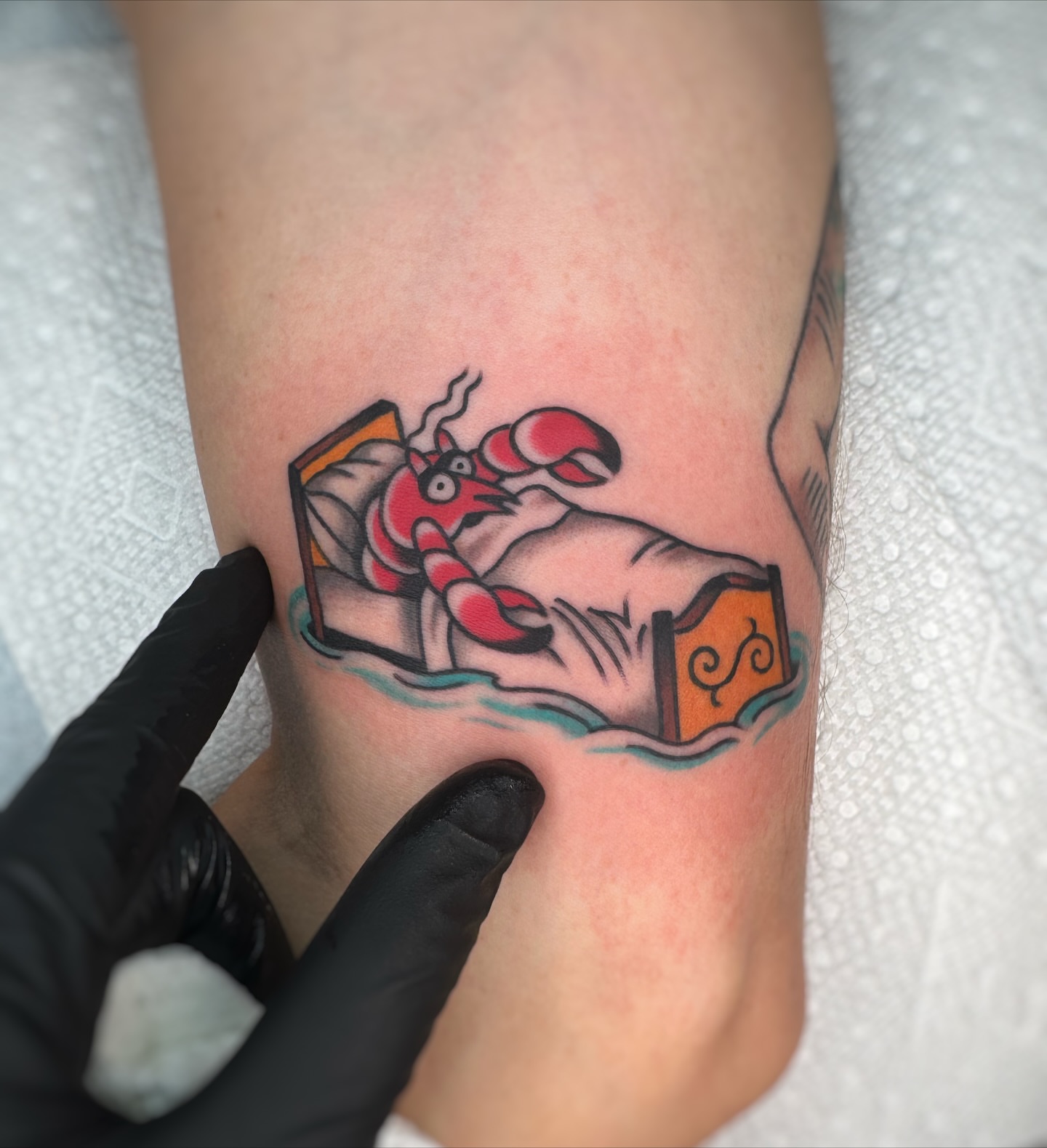 Lobster in bathtub American traditional tattoo on the forearm by Cori James Tattoo Artist