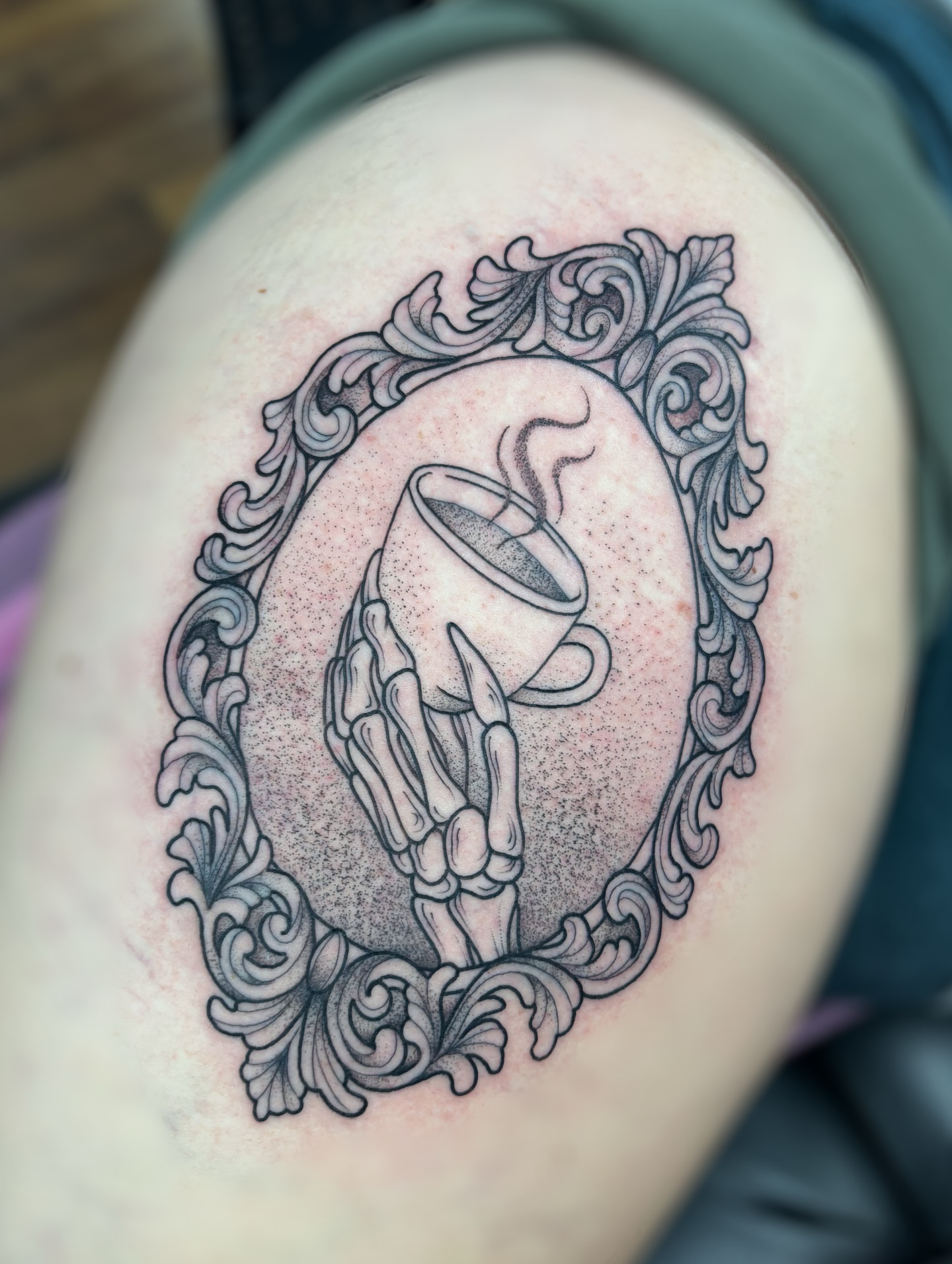 Bone hand holding coffee cup realism tattoo on the shoulder by ✿ sadie winter ✿