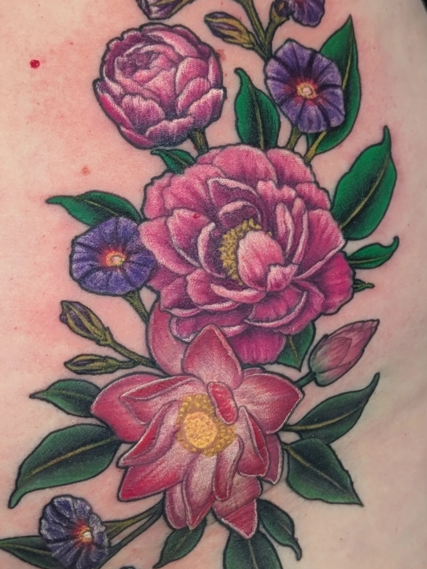 Floral bouquet American traditional tattoo on the upper arm by Jay Trip