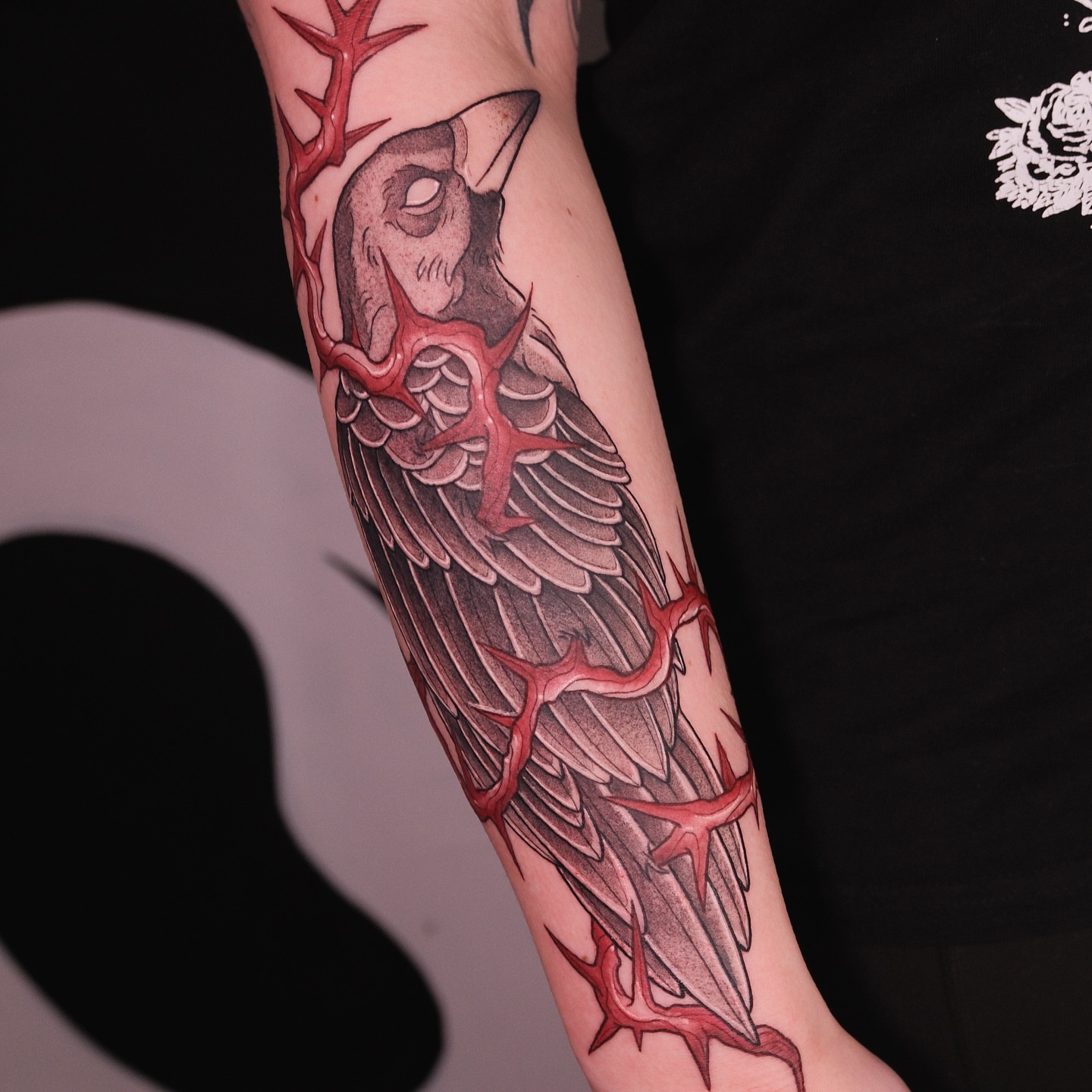Bird with thorns realism tattoo on the forearm by Velvet, Seattle, Washington