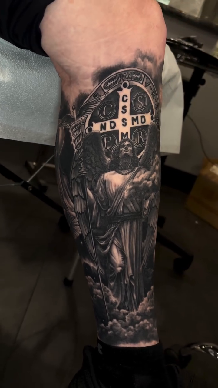 Saint Benedict medal and angel realism tattoo by 🦇𝖀𝖙𝖆𝖍🦇, Las Vegas, Nevada