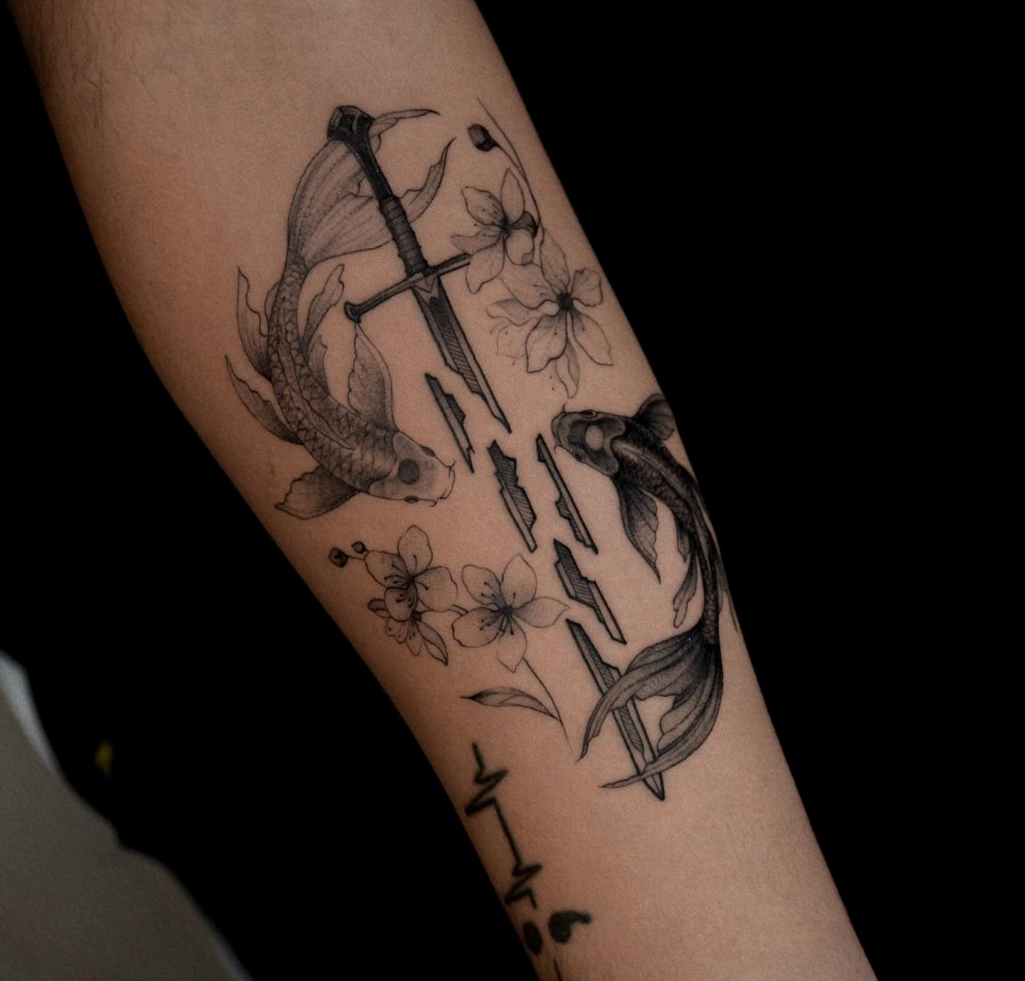 Koi fish and sword realism tattoo on the forearm by Gary Zhong, Upland, California