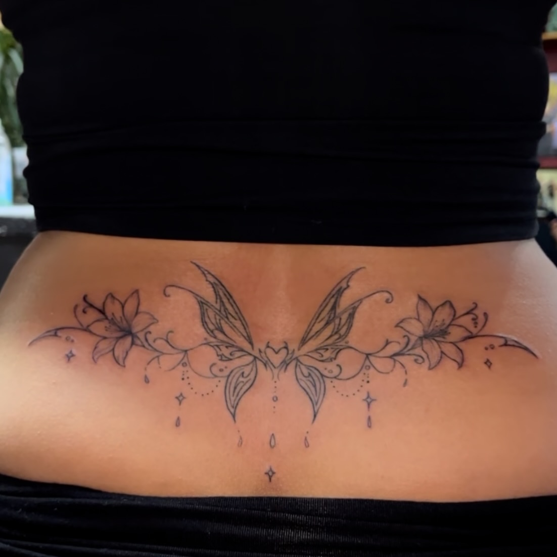 Fairy wings and flowers black and grey tattoo on the torso by Mi♥️Amor♥️Ink
