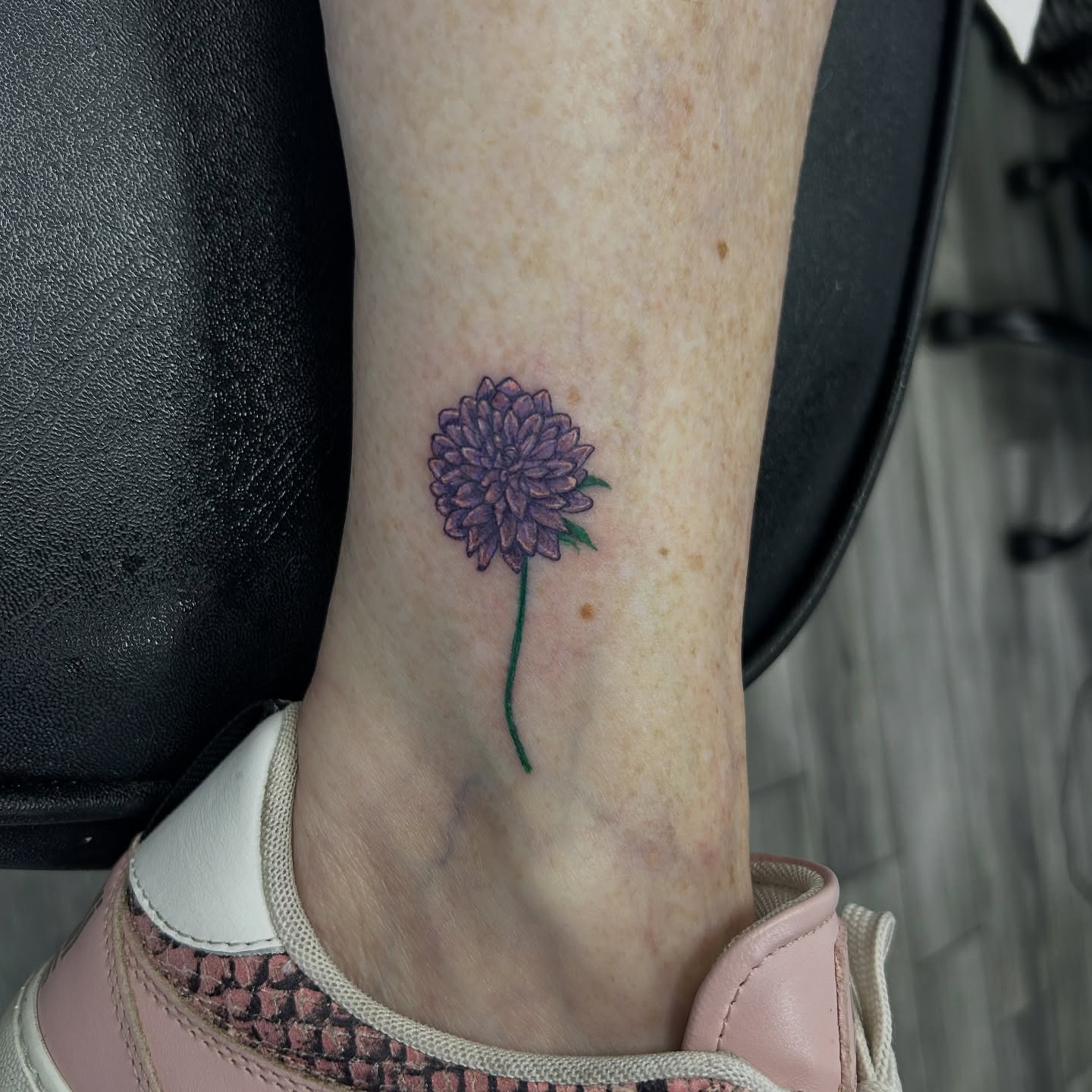 Purple flower dotwork tattoo on the foot by Brittany Brutal