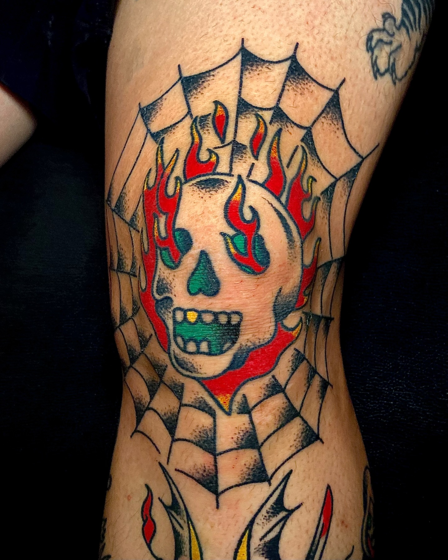 Flaming skull American traditional tattoo on the forearm by Daniel Diego