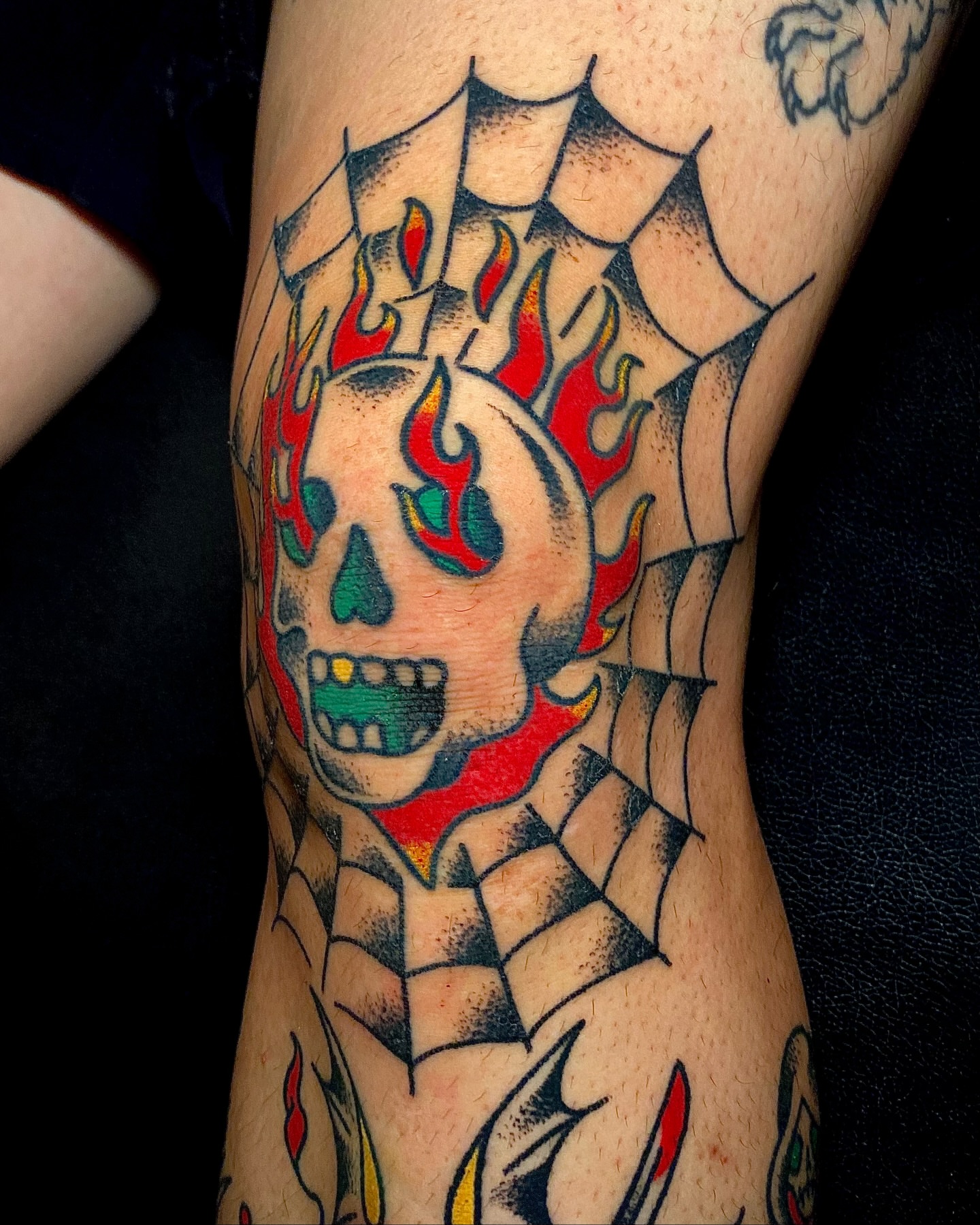 Flaming skull American traditional tattoo on the forearm by Daniel Diego