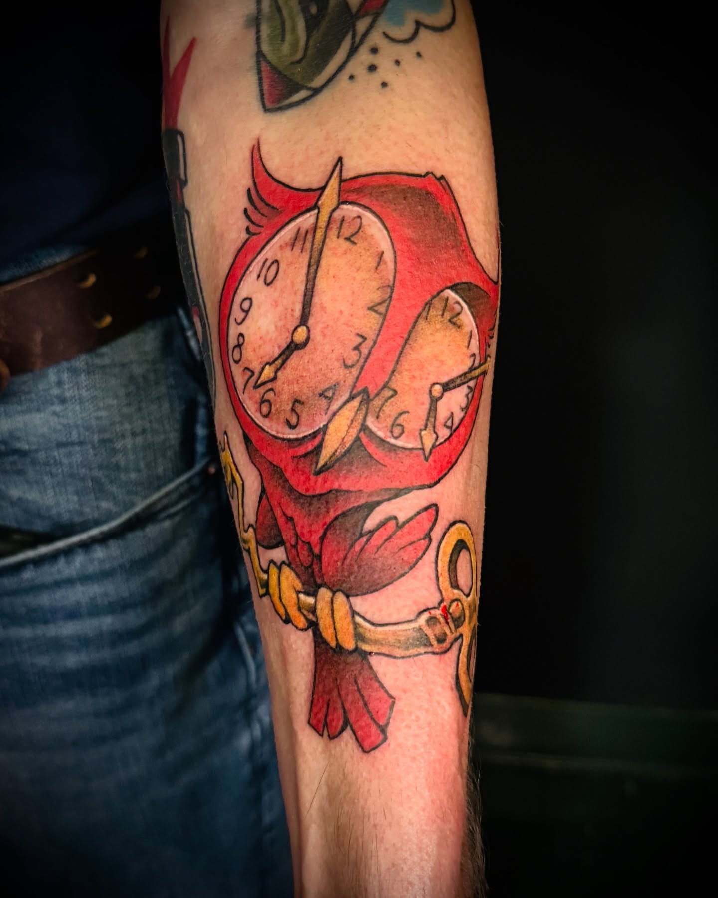 Clocks and scissors American traditional tattoo on the forearm by IX