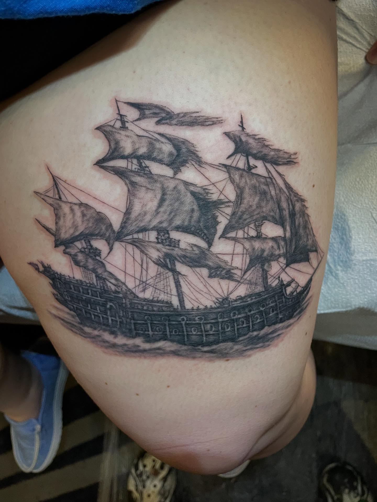 Ship black and grey tattoo on the thigh by Lake Stephens, Richmond, Virginia