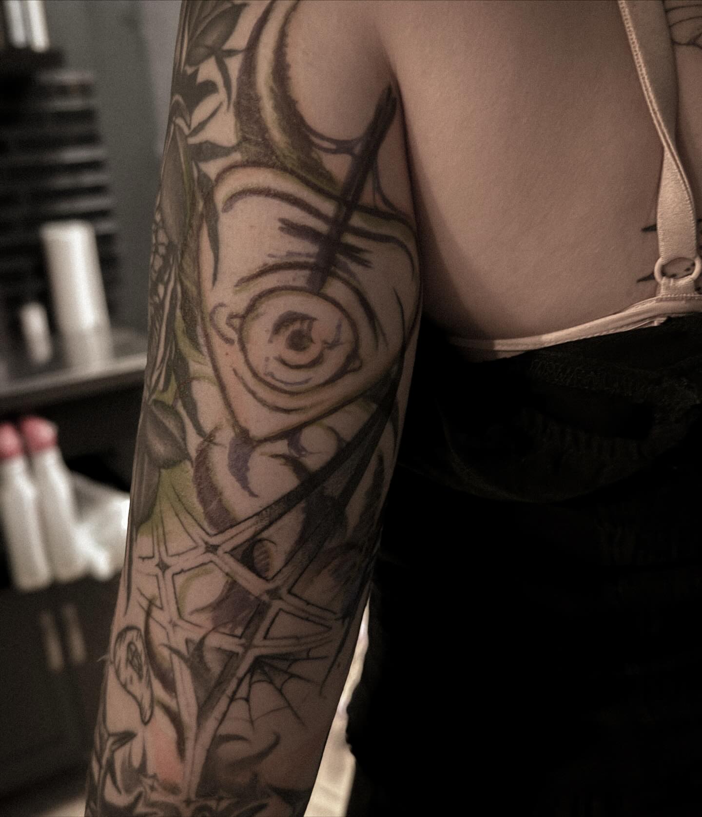 Eye and geometric patterns geometric tattoo on the forearm by La Hyene
