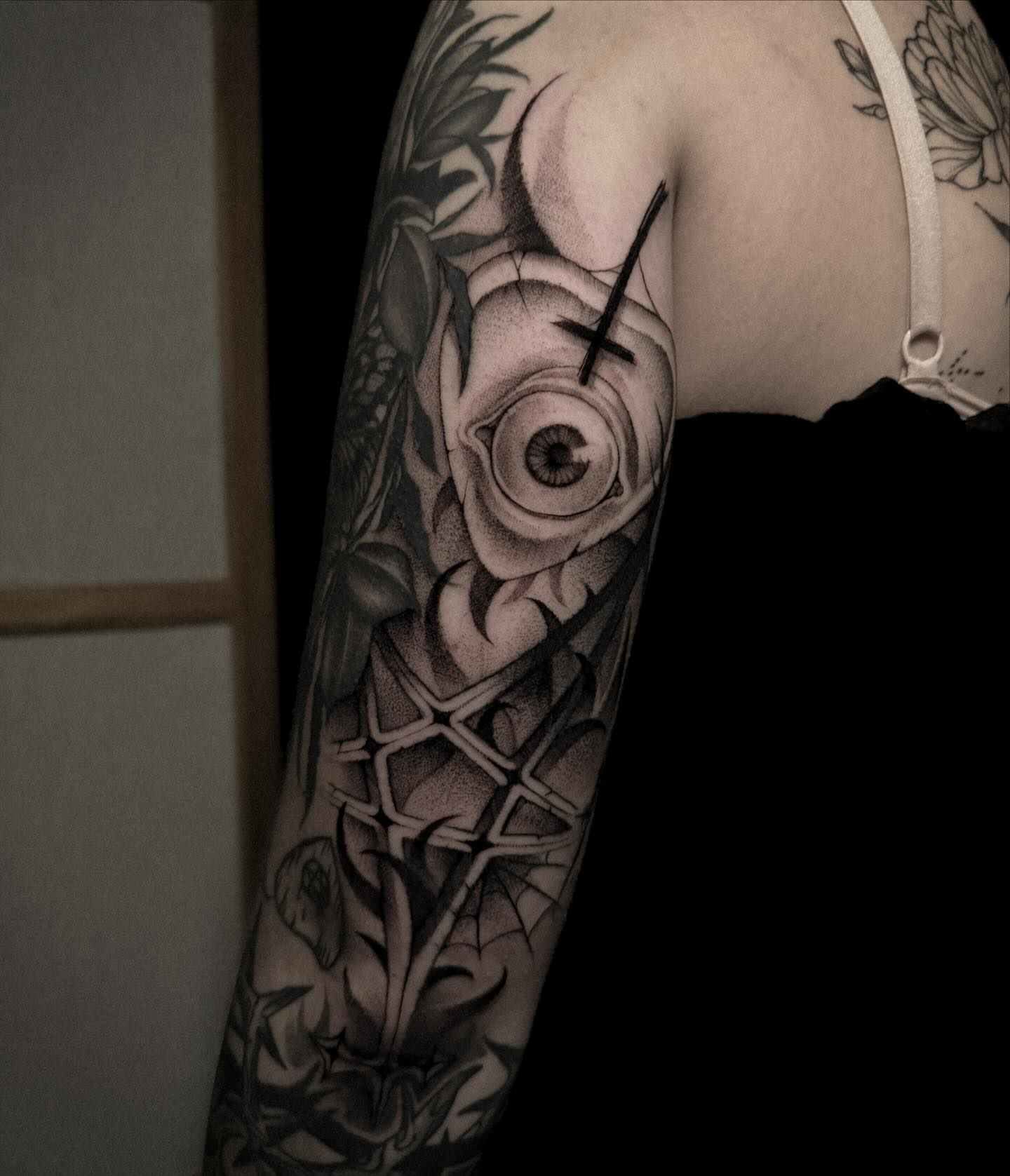 Rose with cross realism tattoo on the forearm by La Hyene