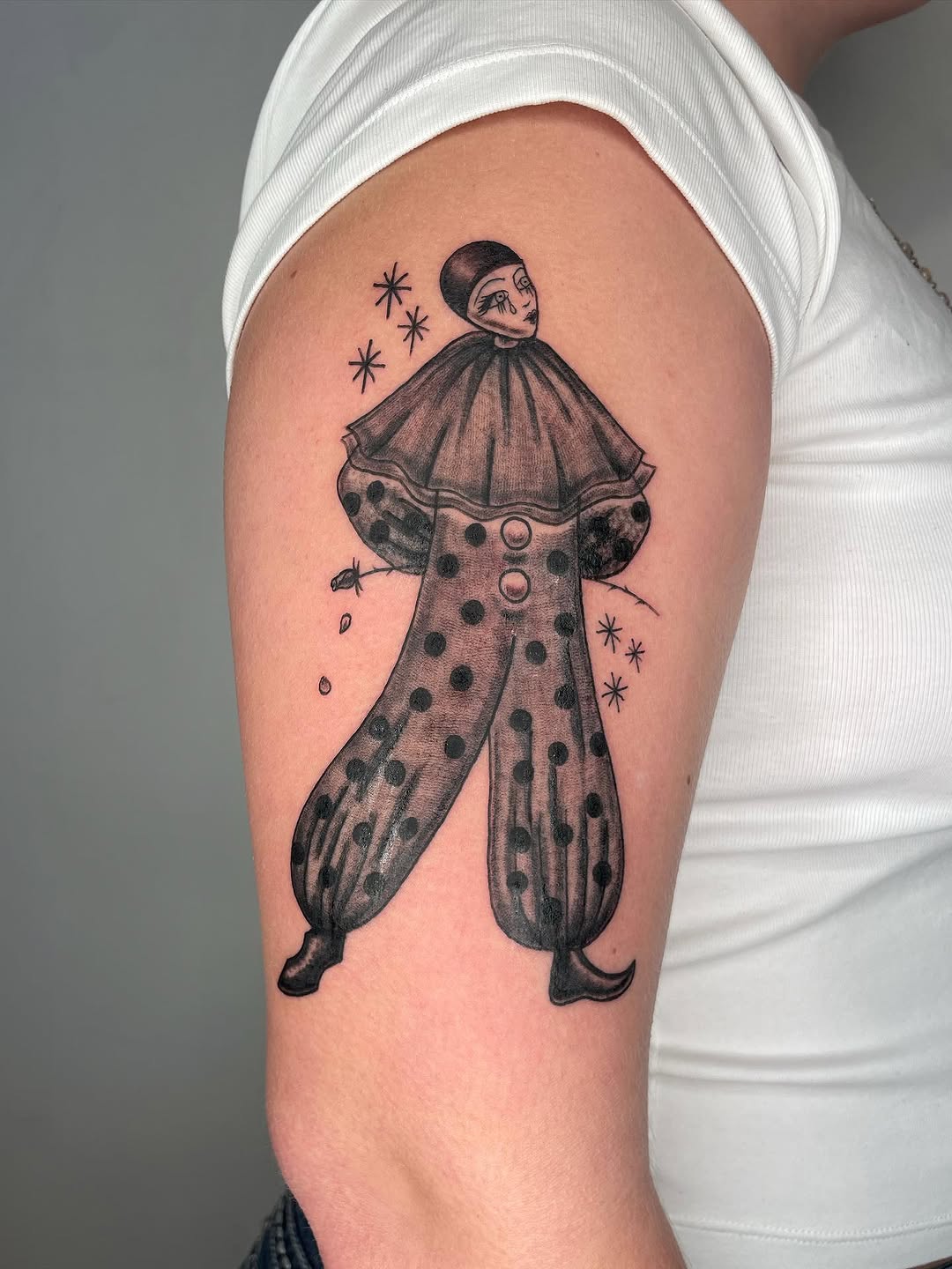 Sad clown ignorant tattoo on the forearm by Fin :
